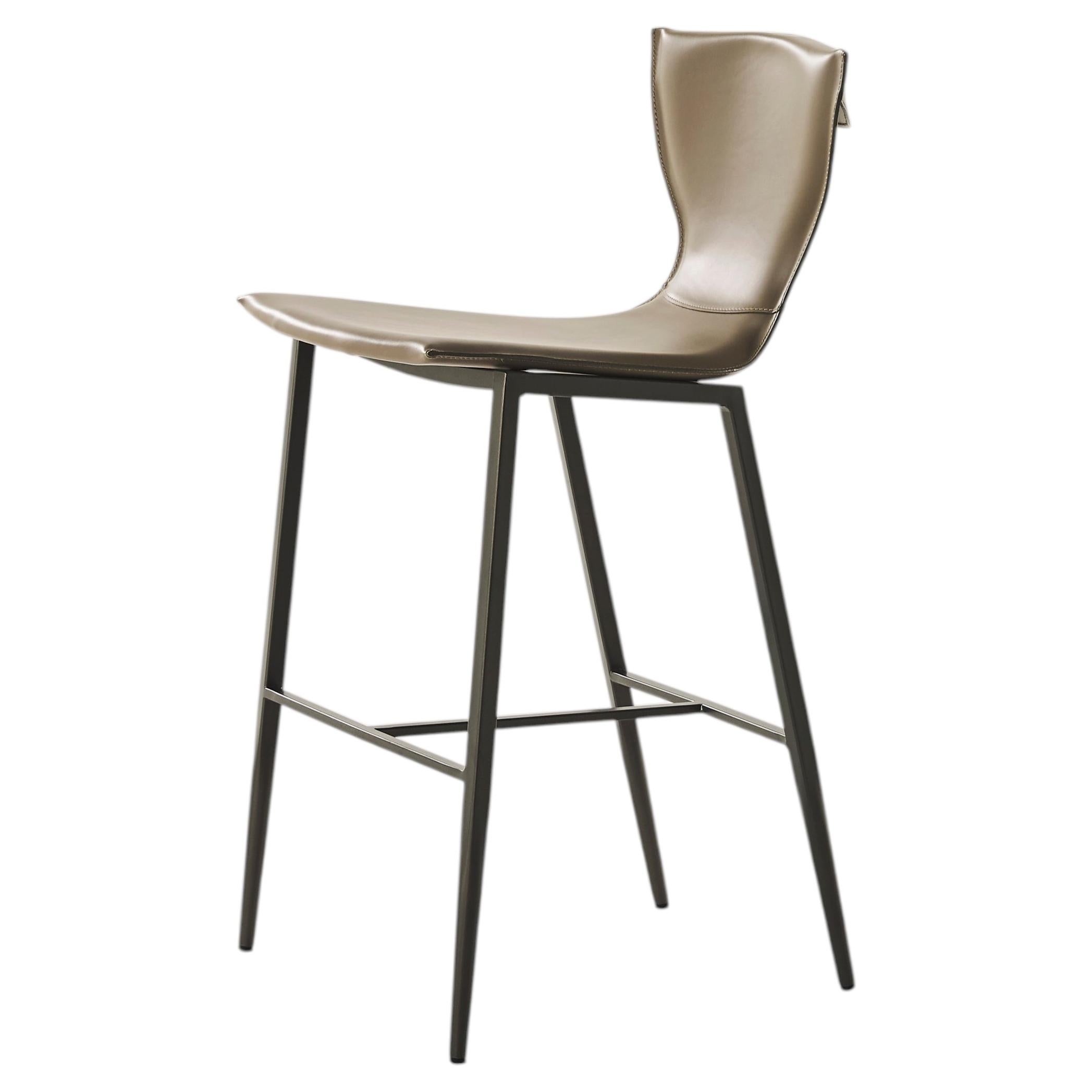 Varenne is a one-piece leather stool with a metal base For Sale