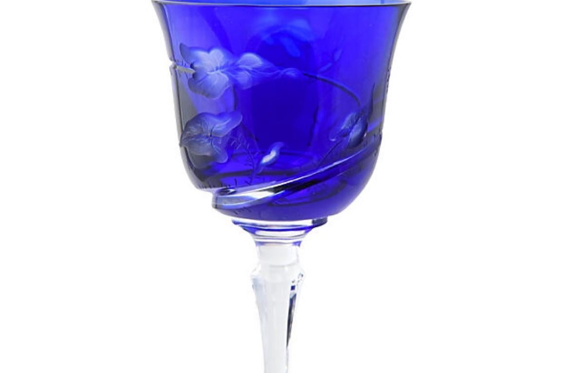 Varga cobalt crystal goblet with detailed butterfly and leaf pattern cut and polished by hand. The clear lead crystal is encased in colored lead crystal, the glass is cut through the colored crystal to the clear crystal underneath. Measures: Base,