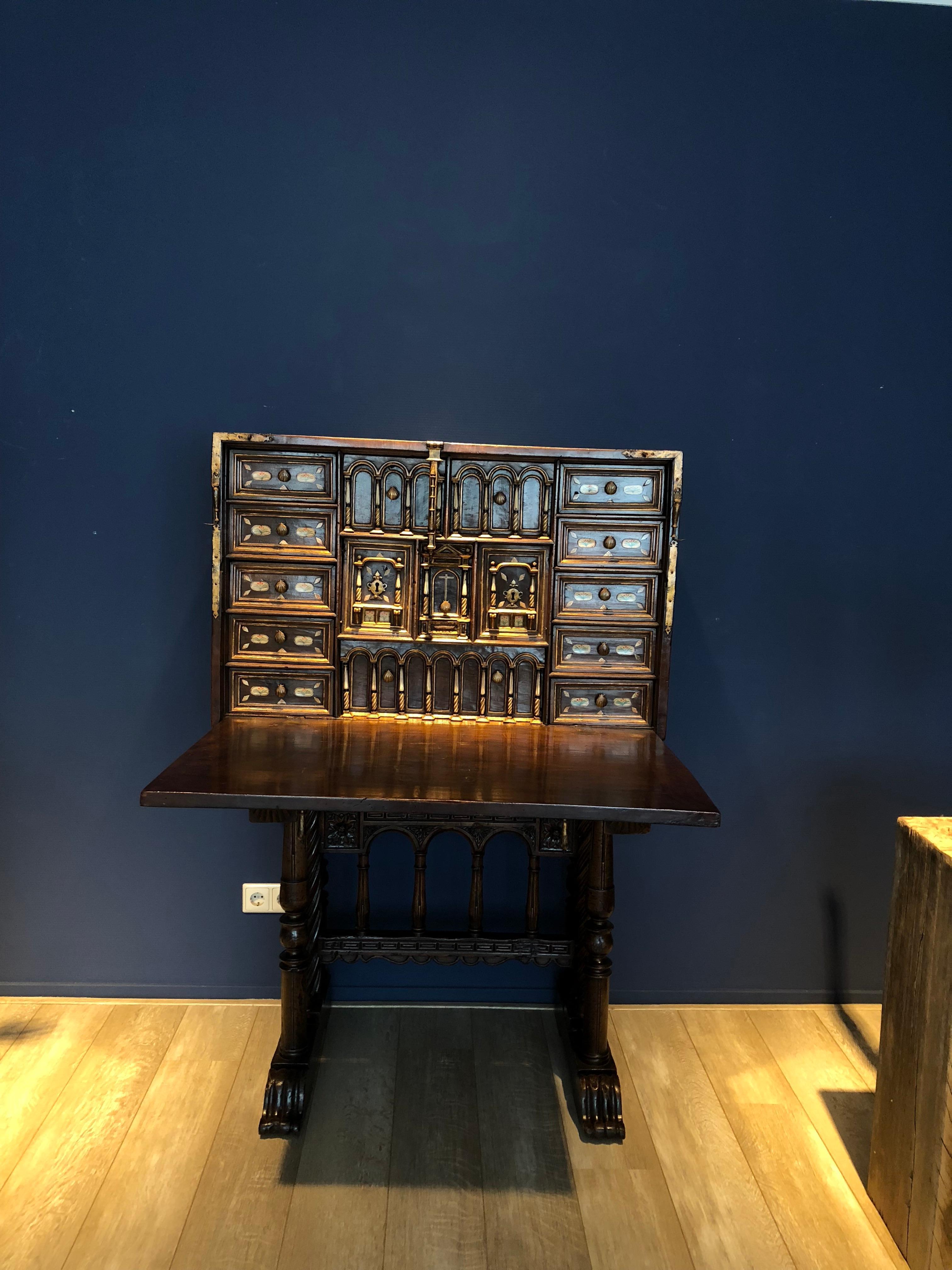 This late 16th-17th century Spanish Walnut Vargueno or Bargueno desk is a form of portable
desk, resembling the top half of a fall front desk. It is basically a chest or box with the top
panel, serving as a “lid.” It folds down to become a