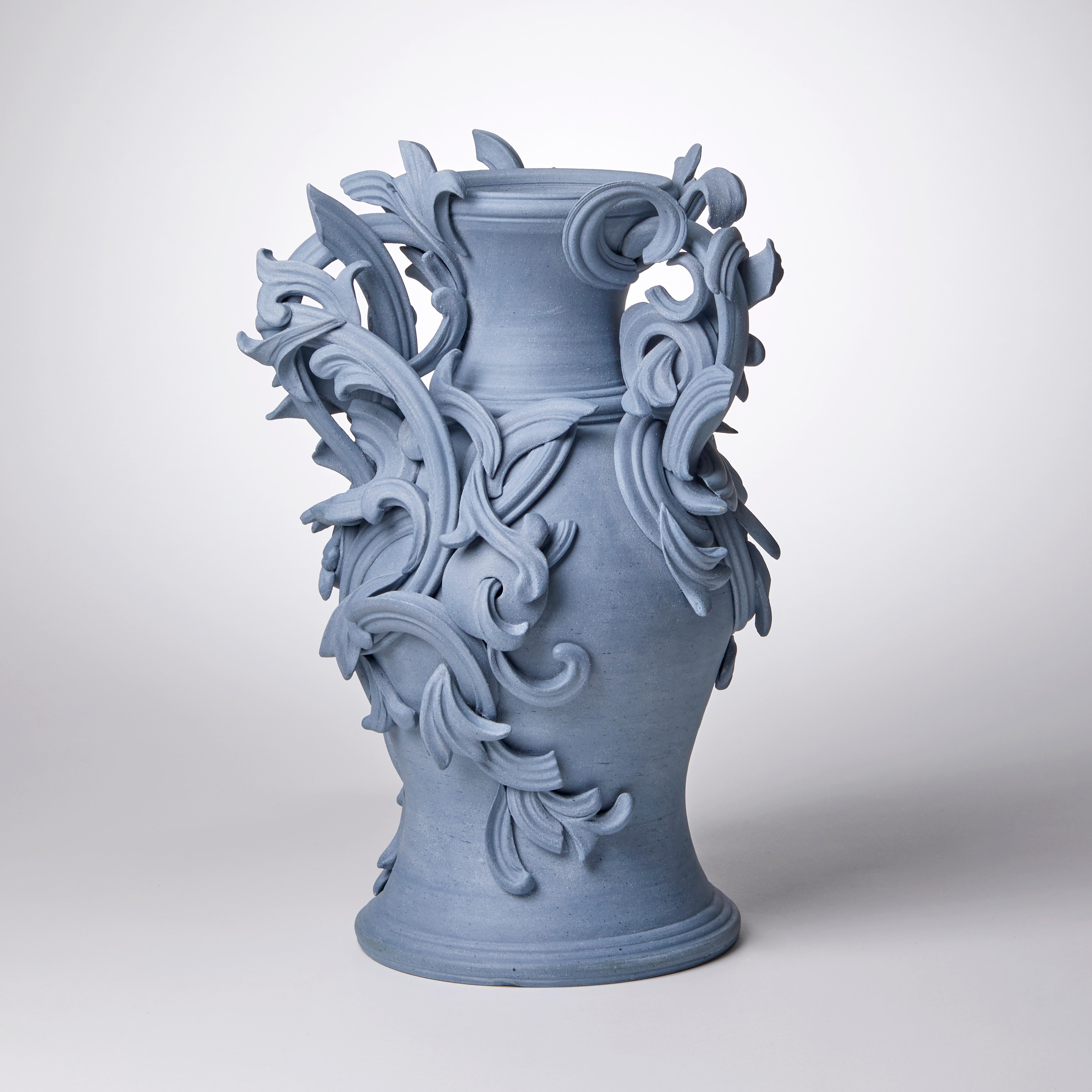 Vari Capitelli IX is a unique handmade colored stoneware ceramic sculptural vase in blue by the British artist Jo Taylor. The central form has been thrown on the potter's wheel and also hand-built, then adorned with architectural inspired flourishes