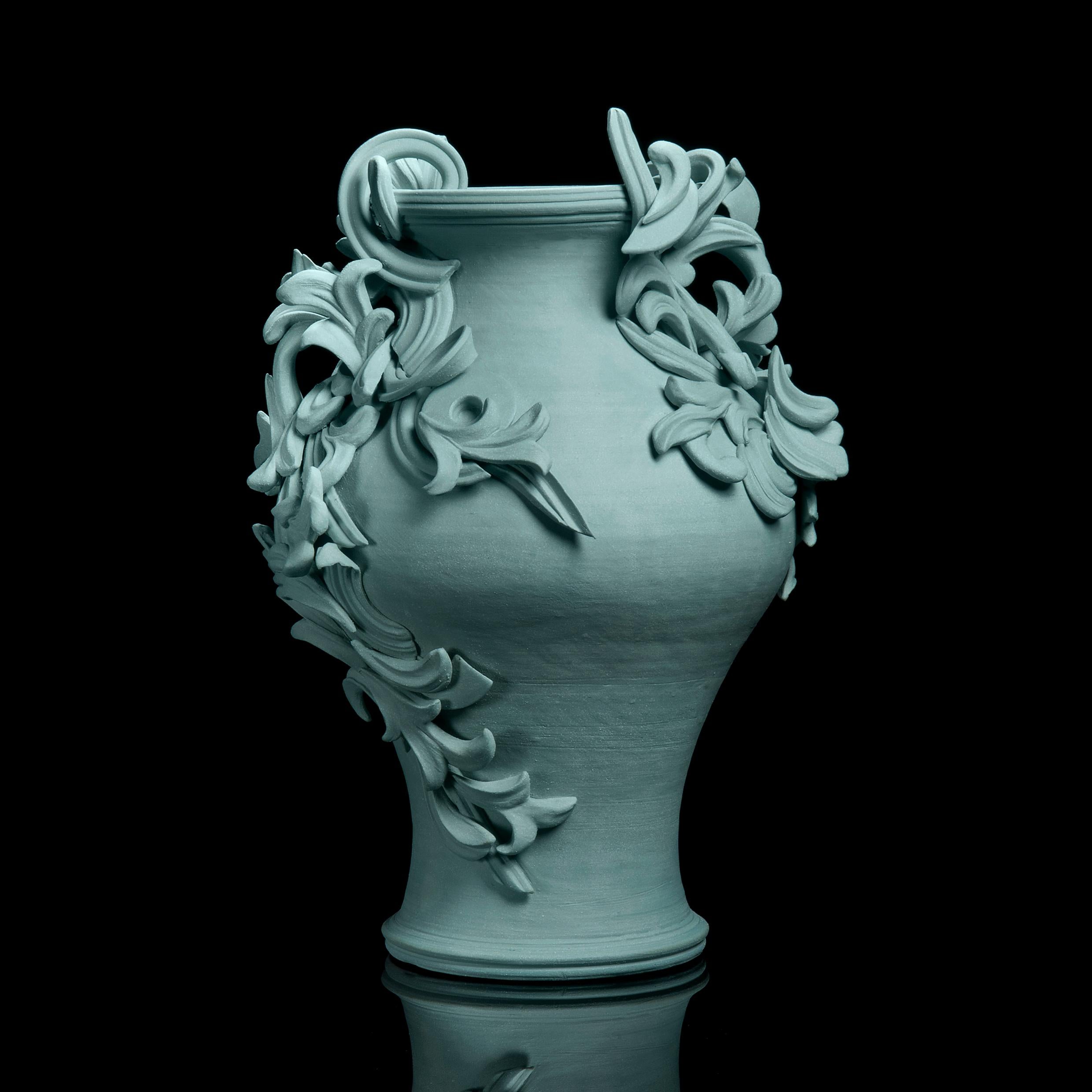 Vari Capitelli VI is a unique handmade coloured stoneware ceramic sculptural vase in soft jade green by the British artist Jo Taylor. The central form has been thrown on the potter's wheel and also hand-built, then adorned with architectural