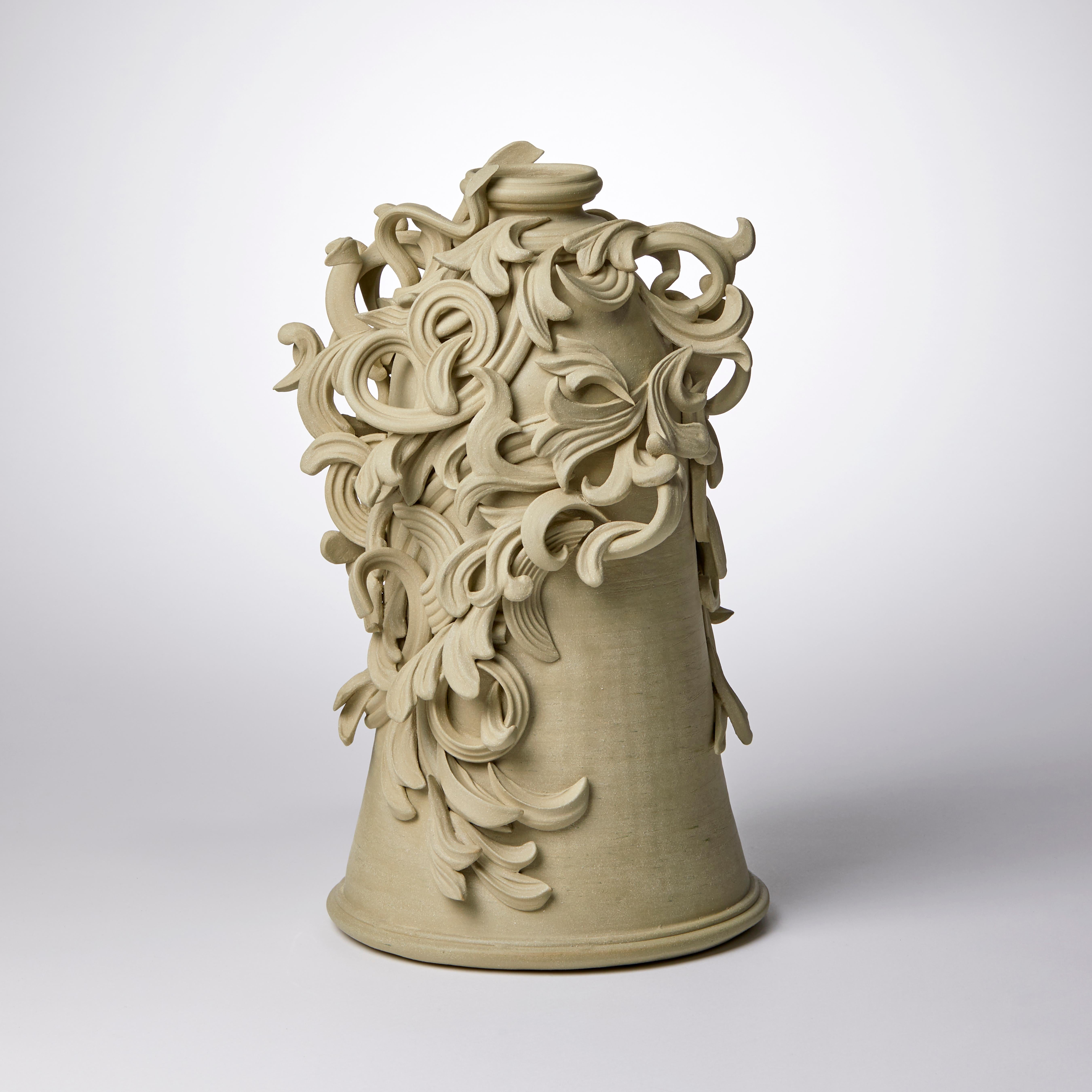 Vari Capitelli VII is a unique handmade colored stoneware ceramic sculptural vase in soft ochre green by the British artist Jo Taylor. The central form has been thrown on the potter's wheel and also hand-built, then adorned with architectural