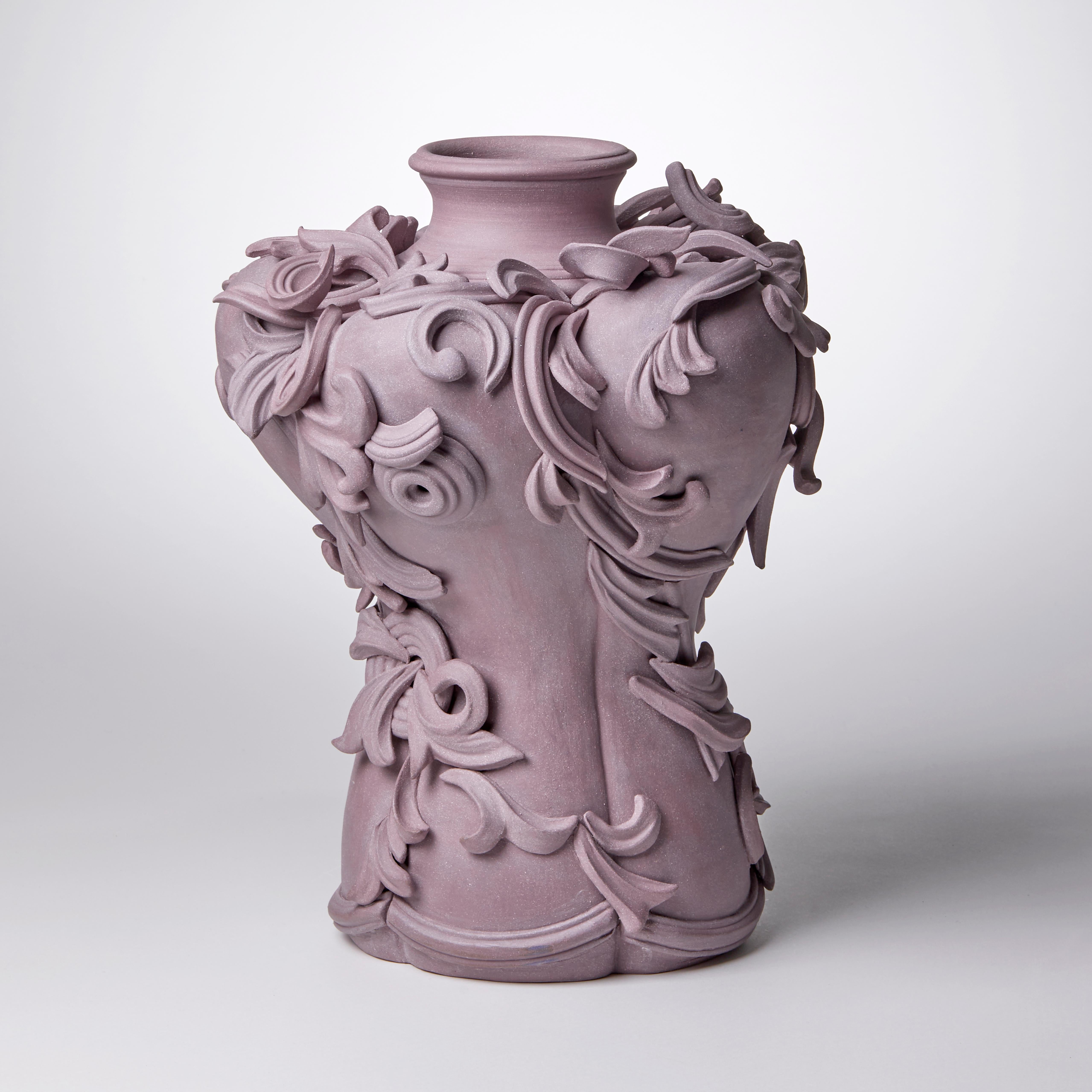 Vari Capitelli VIII is a unique handmade coloured stoneware ceramic sculptural vase in dusky damson & plum purples by the British artist Jo Taylor. The central form has been thrown on the potter's wheel and also hand-built, then adorned with