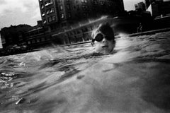 Analogue underwater photography, framing, black and white, swimmers in a pool