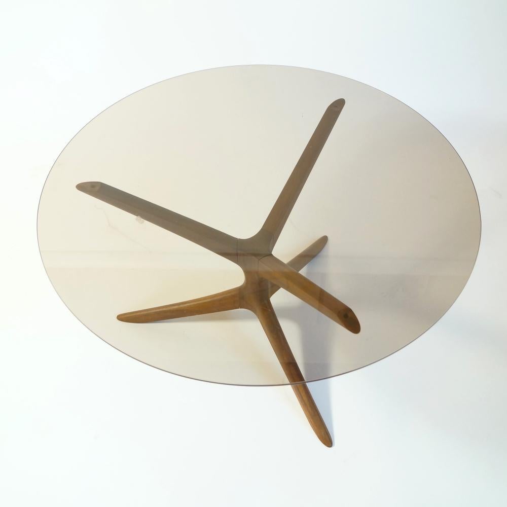 Vari coffee table is designed by interior designer Lea Nevanlinna in the 1950s. The table frame is made of seven parts, which joined together form a seamless and organic shape.
The tabletop is smoked glass and the foot is teak.

 