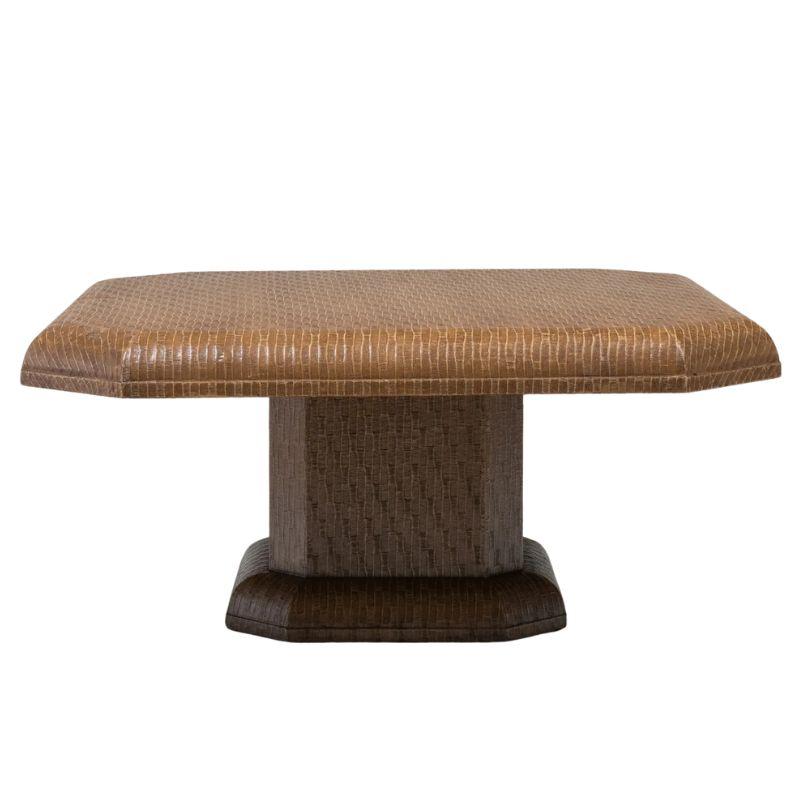 A vintage variable height textured pedestal table, perfect as a coffee table and raises up with a lever to become a games table or dining table.  The square shape table with angled corners is lacquered fabric to create a texture similar to Karl