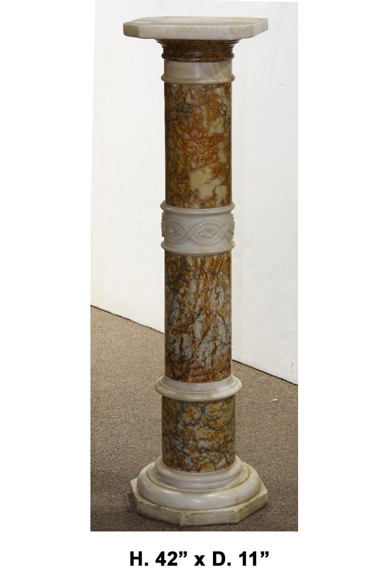 Beautiful Italian neo classical style variegated marble pedestal with finely carved white marble bracelet in the center, early 20th century 
The square white marble top with canted corners is over turned brown and yellowish capital resting on