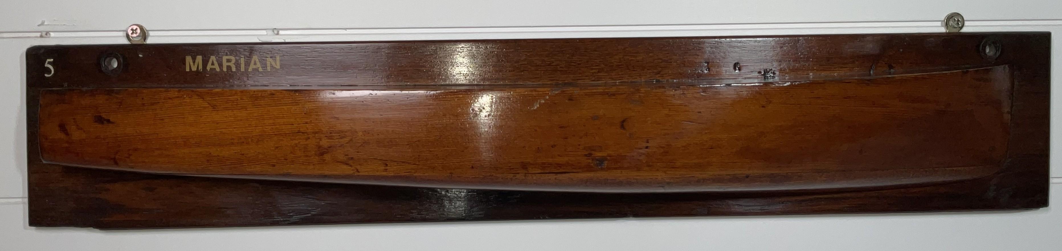 Antique carved half-hull model of a motor yacht with backboard. Note on back reads: “Motor Launch Marion, 33; dated 1908, owner A.T. Vilyard.”

Weight:    3 lbs.
Overall Dimensions:    5