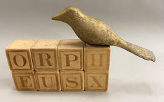 Scultura Orfeo con uccello e blocchi