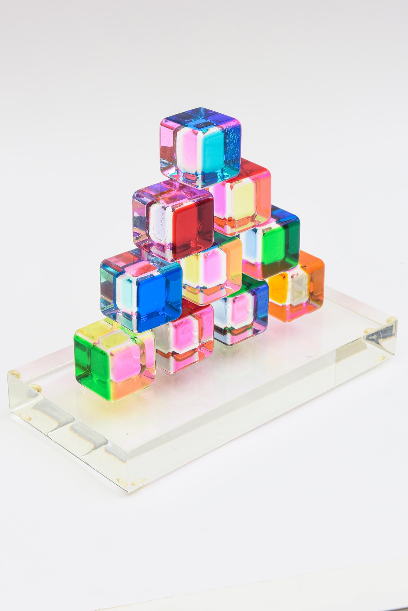 This set of 10 signed and dated Vasa laminated lucite sculptures sit on a lucite base that you can play with the interchange of color by moving then around and creating a new scape each time. it is fun and has great energy of color. The colors range