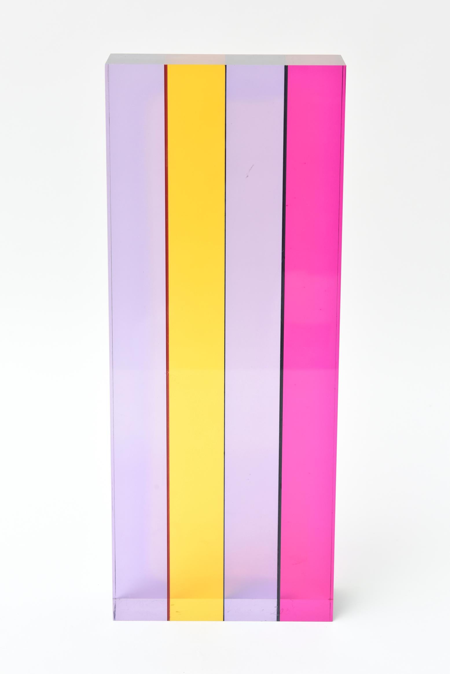 This amazing signed Vasa Mihich laminated Lucite tower sculpture has luscious layers of colored Lucite in juxtaposition. It is from 2001. Signed Vasa@2001. Each wonderful way you turn this tower sculpture it changes in color waves and blocks. The