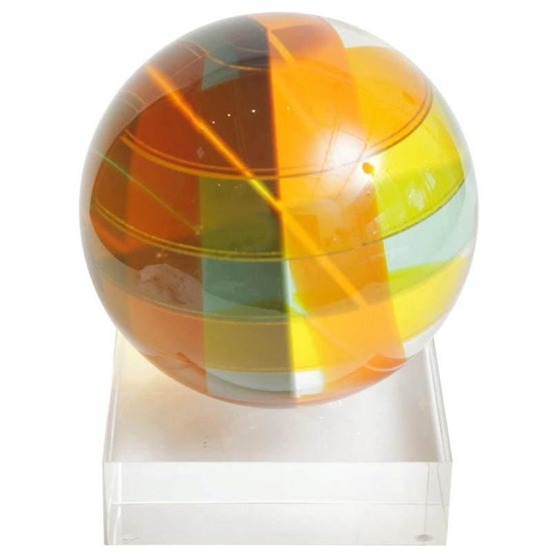 This fabulous arresting monumental signed and dated Vasa Mihich laminated Lucite sphere ball sculpture sits on a custom Lucite base newly made. The planes of color vary with each turn and play of light. They vary with colors of orange, yellow,