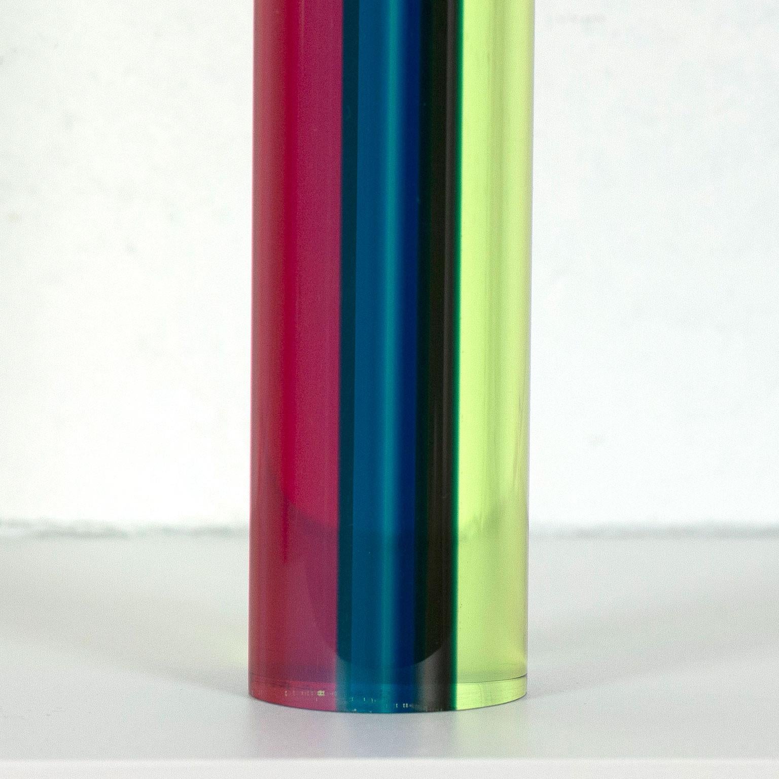 This is a vibrant new example of Vasa Mihich's unique and delightful cylinder sculptures. 

This cylindrical sculpture is an ideal table or desktop size, emitting colorful shadows far greater than it's scale. The cylinder is bisected vertically by a