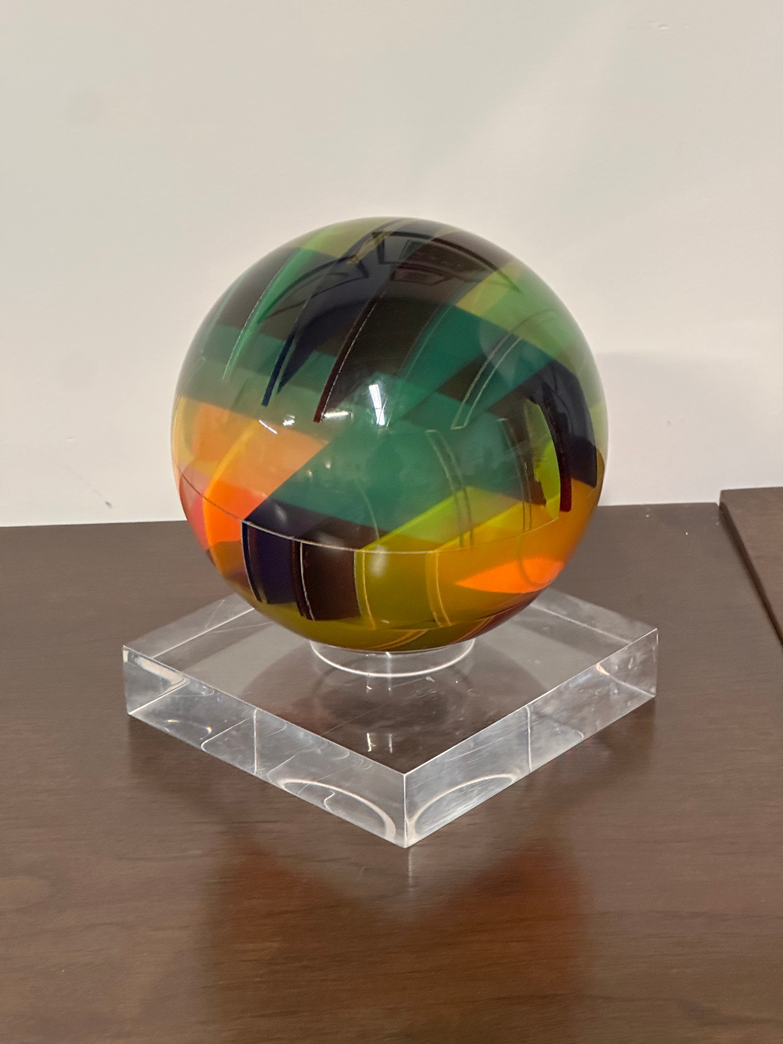 Vasa Velizar Mihich Signed Op Art Acrylic Sphere on Lucite Base

This is an Op Art spherical sculpture of cast acrylic, with internal color wedges. Its appearance can be changed simply by rotating the sphere on its base and allowing the light to
