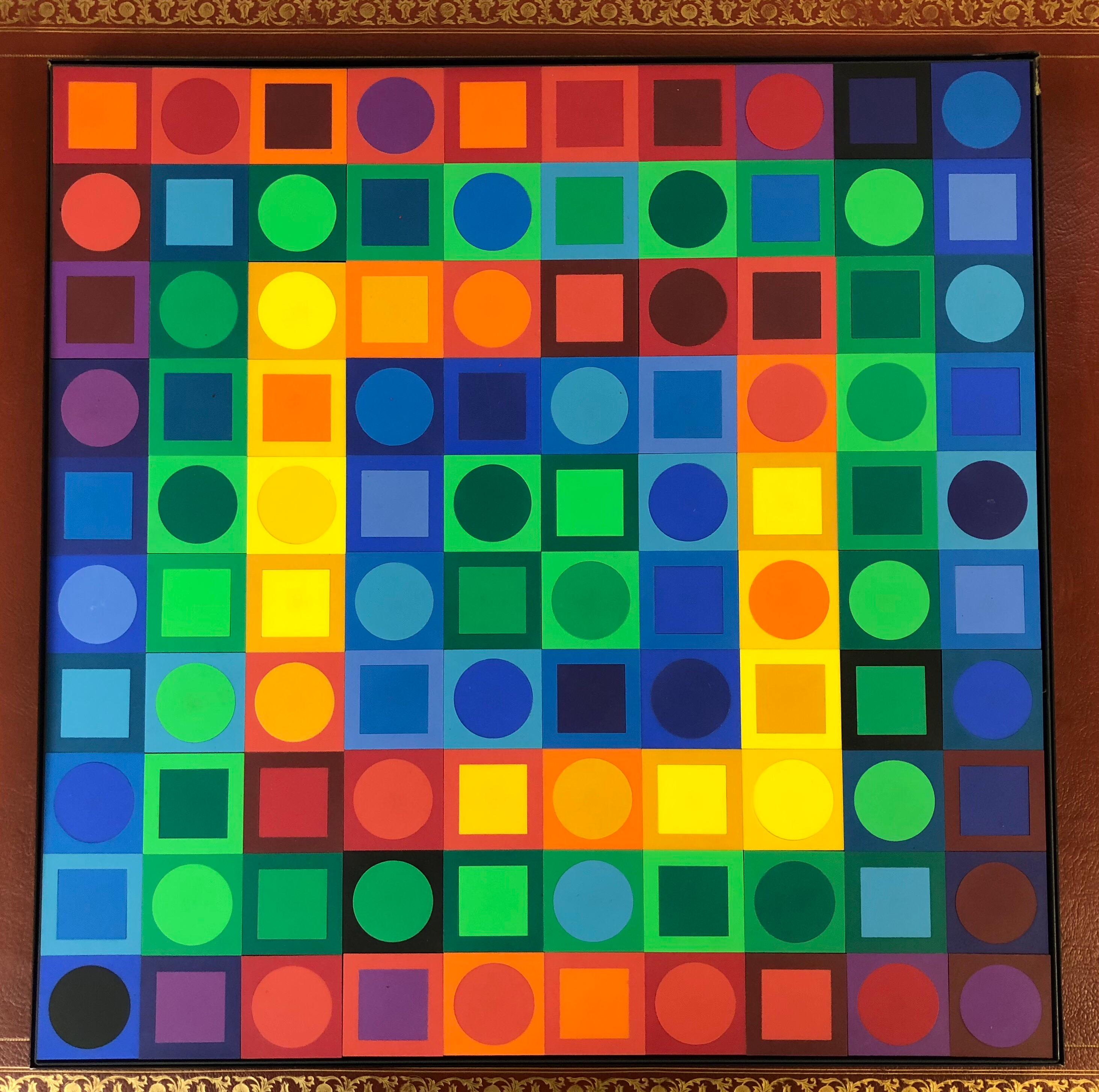 This is a puzzle by Vasarely. An interactive work of art. The plastic pieces have little magnets on the back. The design is displayed in a thin metal tray that can be hung. As presented it takes 200 pieces to complete the design, and there are also
