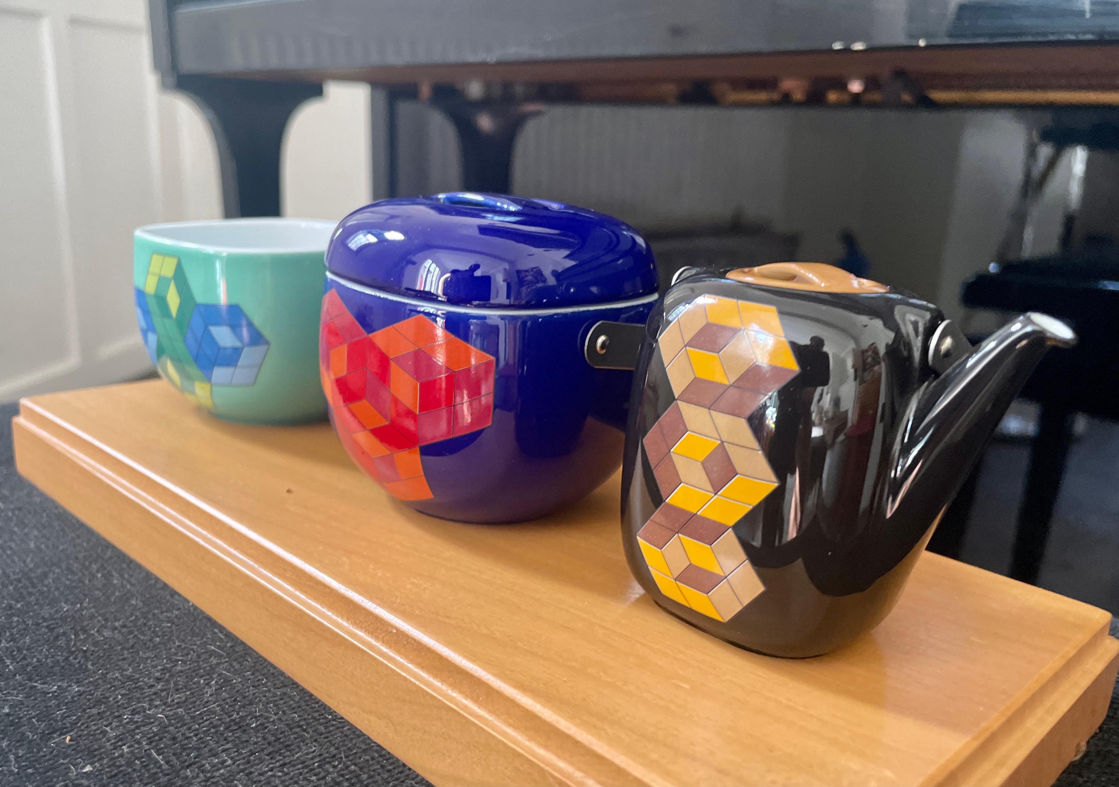 Victor Vasarely 
Three-part miniature crockery on a wooden tray Artists: Victor Vasarely, Timo Sarpaneva, 1976 Manufacturer: Rosenthal
 Celebration of the 25th Anniversary Special Edition White enameled porcelain with polychrome paint The handles