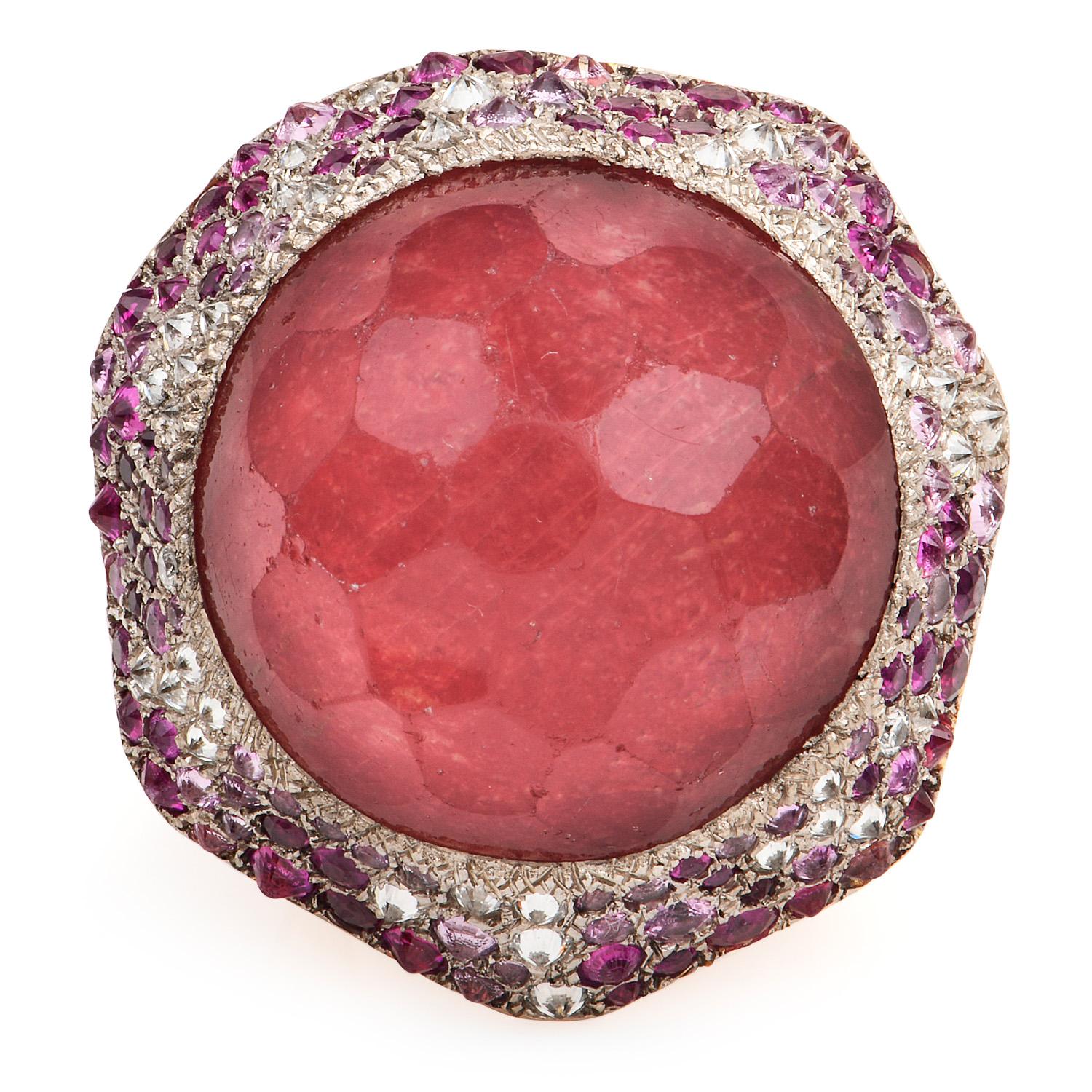 This Vasari, Spanish brand, large cluster design cocktail ring, definitely a Statement, icebreaker piece.

Crafted in solid heavy 18K yellow & white gold, the center is adorned by a pink Tourmaline Weighing approx. 28.20, measuring 25 mm, Bezel