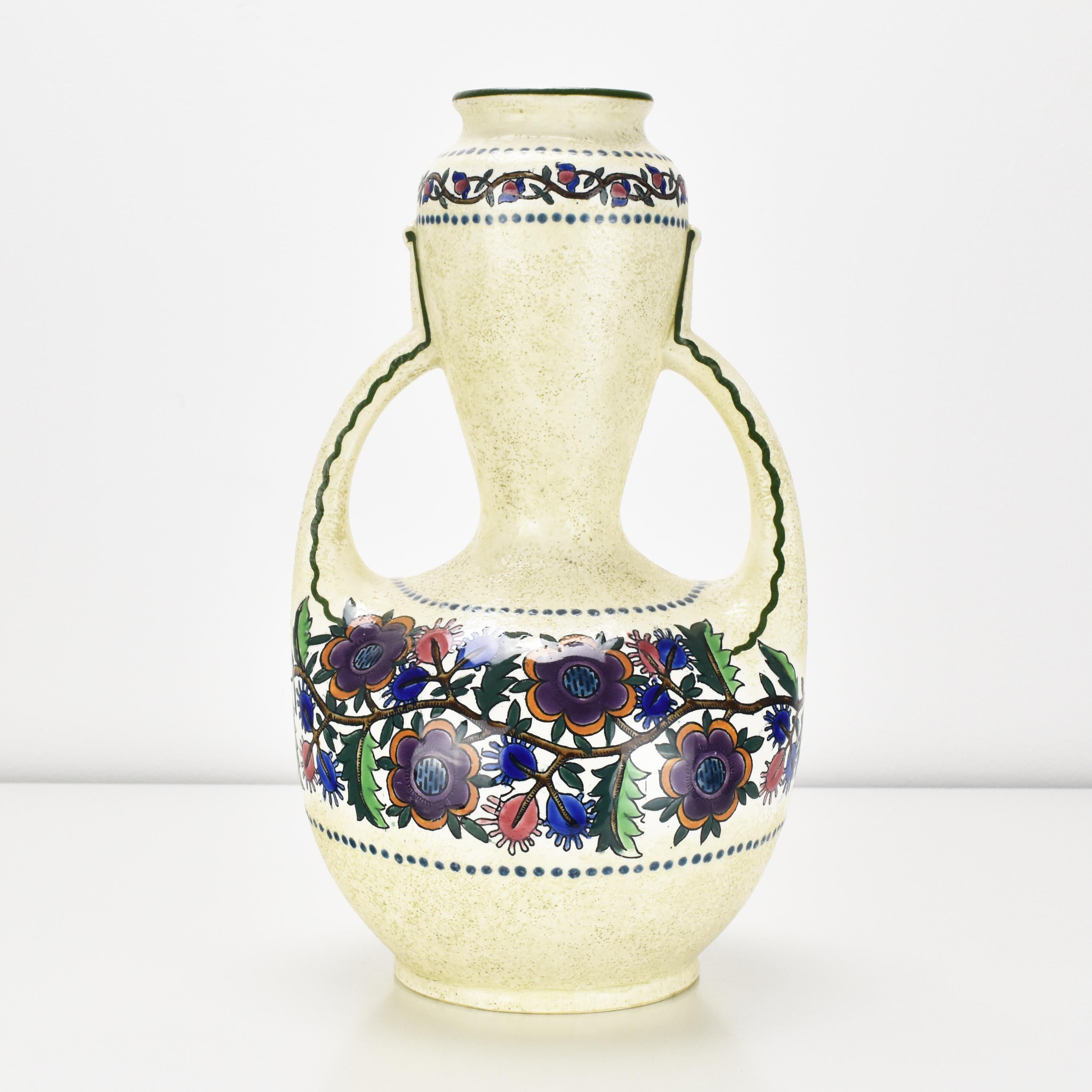 This large and unusual floral hand-decorated double-handled ceramic vase by Ampora Turn-Teplitz showcases the characteristic artistic sensibilities of the Art Nouveau Vienna Secessionist era, with a focus on organic forms and natural motifs.

The