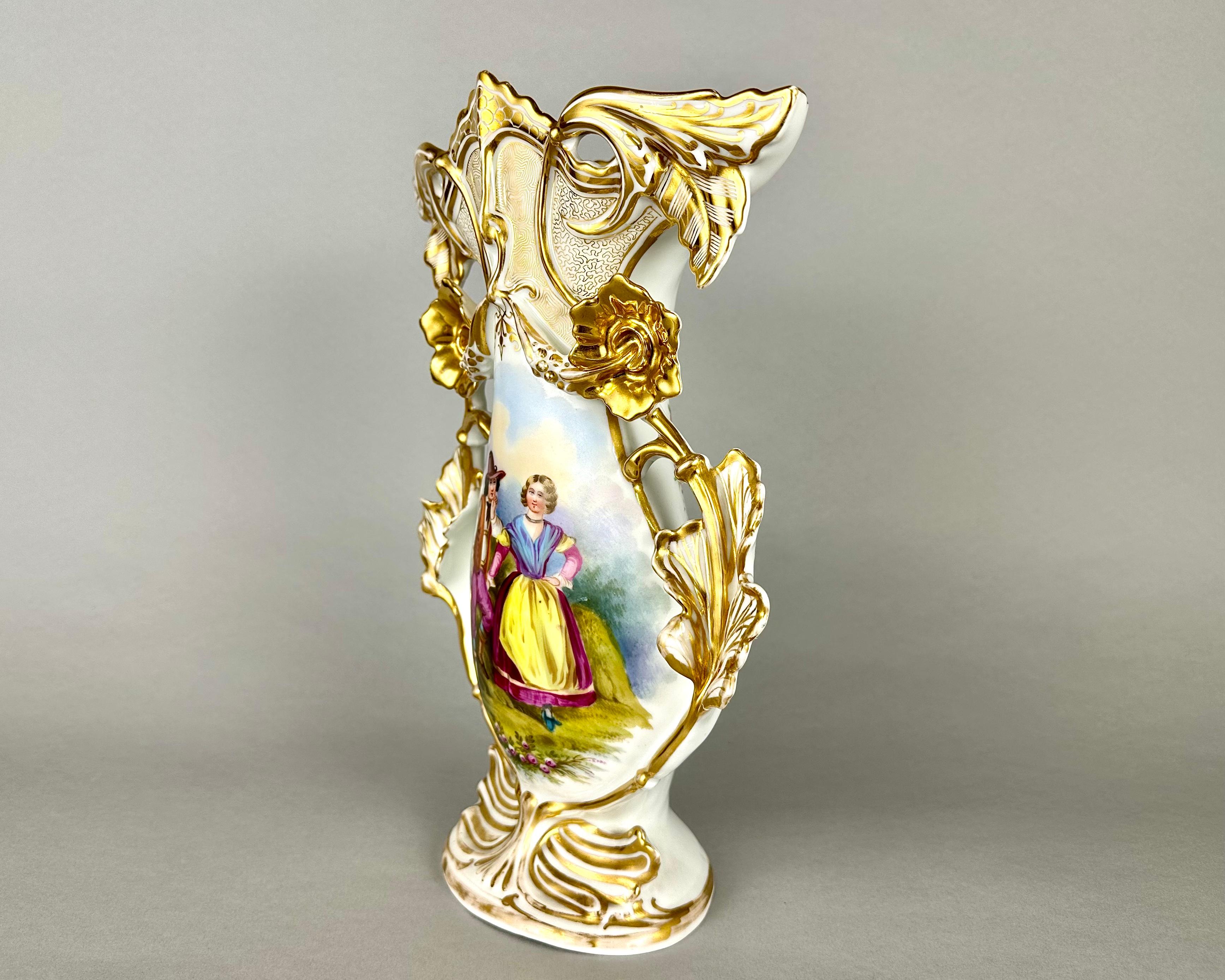Stunning antique porcelain vase with flower handles and elaborately shaped tops crafted in France during the end of 19 Century and Early 20th.

Featuring ornate Rococo design in the style of early Meissen.

With hand painted floral motif to one side