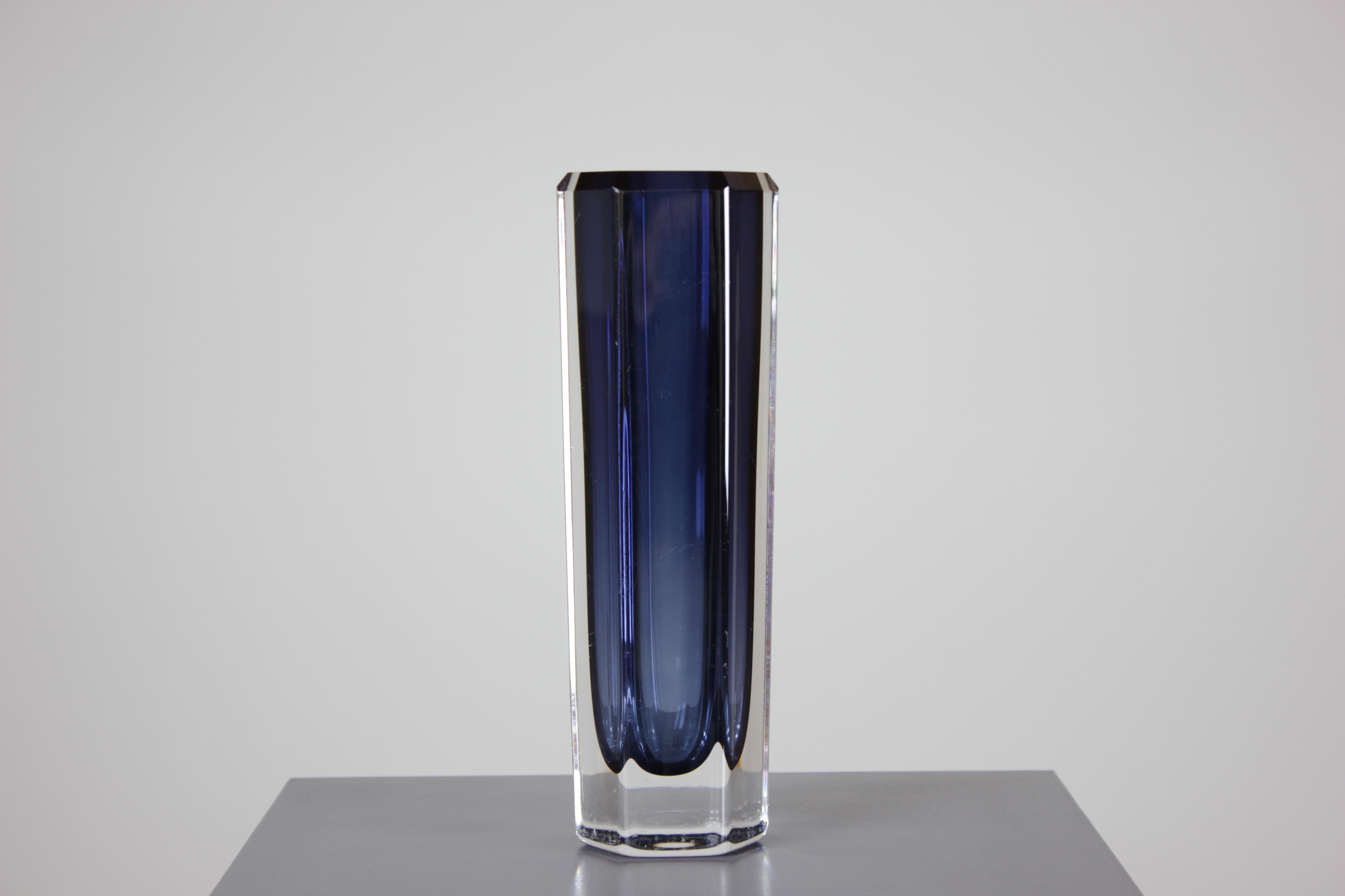 Introduce a touch of artistic elegance to your home decor with this exquisite Mid-Century Glass Art Vase designed by Bengt Edenfalk for Skruf Glasbruk. Crafted with meticulous attention to detail, this authentic glass art vase exudes timeless beauty