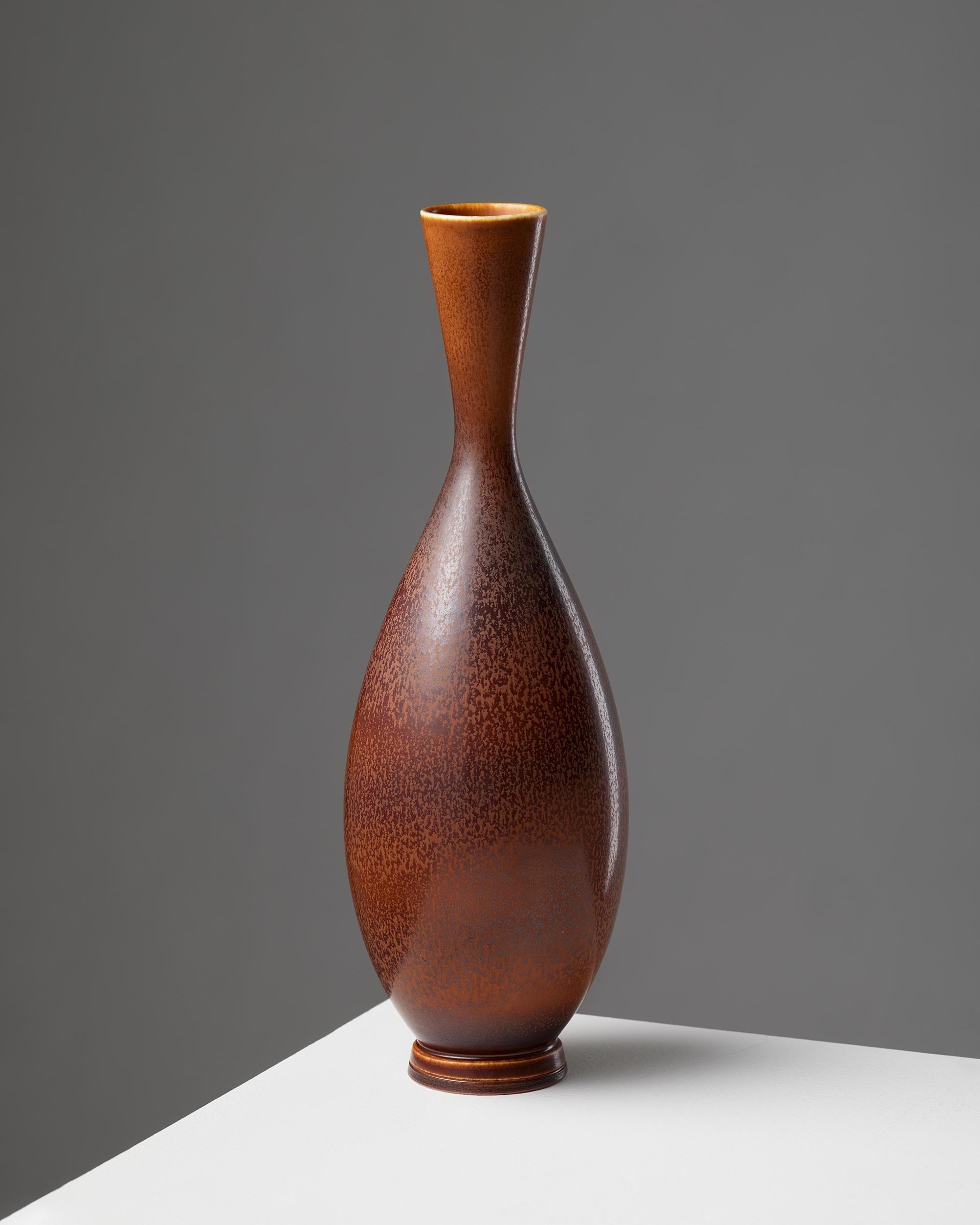 Vase by Berndt Friberg for Gustavsberg, Sweden, 1965

Signed.

H: 25 cm
Diameter: 7.5 cm

Berndt Friberg was born in the southern Sweden town of Hoganas. He came from a long line of ceramists, in an area steeped in the tradition of finely crafted