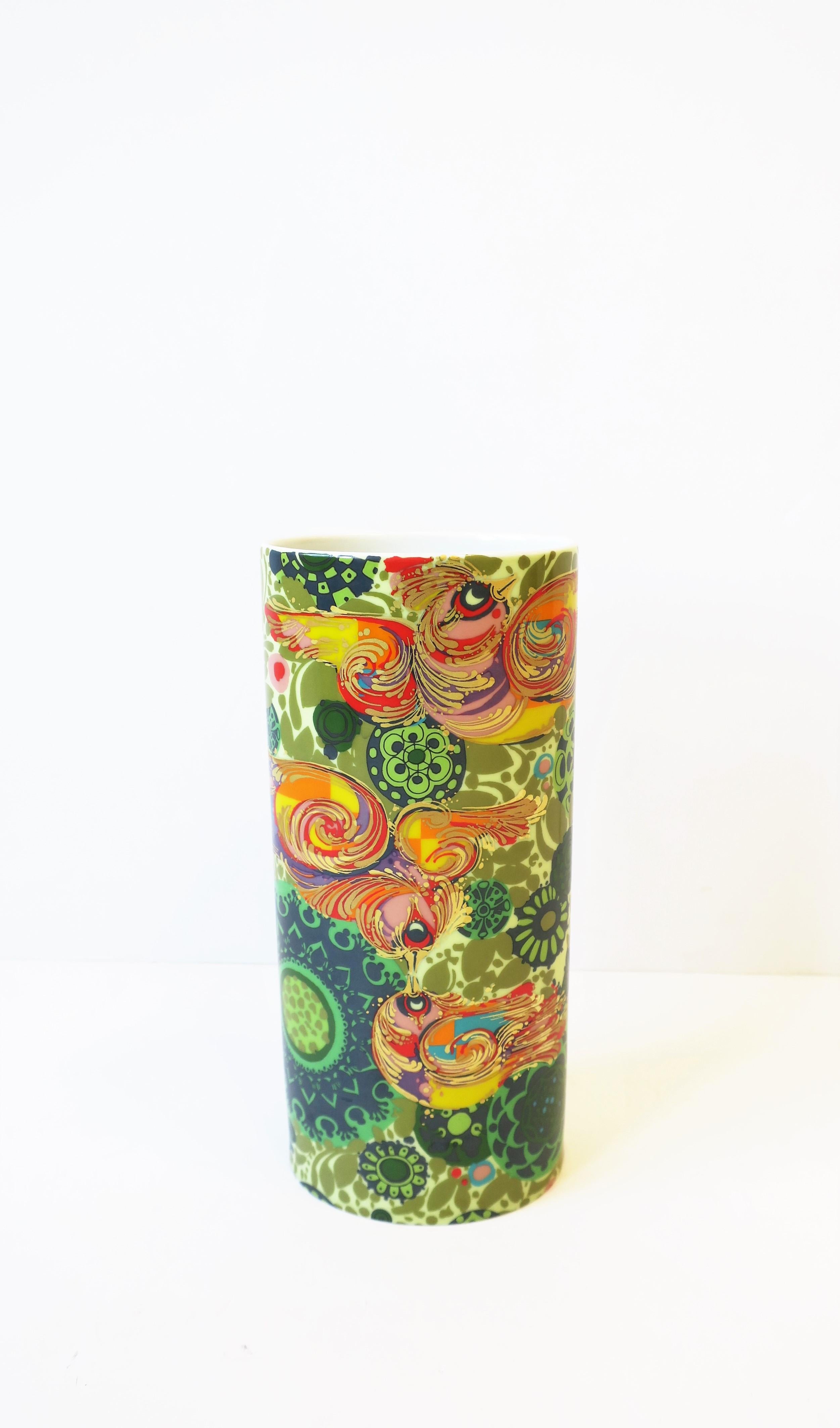 A beautiful German porcelain vase by Danish artist and designer Bjorn Wiinblad for Rosenthal Studio-Line, circa 1970s, 20th century, Germany. A colorful palate with gold bird design. With designer and marker's mark on bottom as show in image #13. A