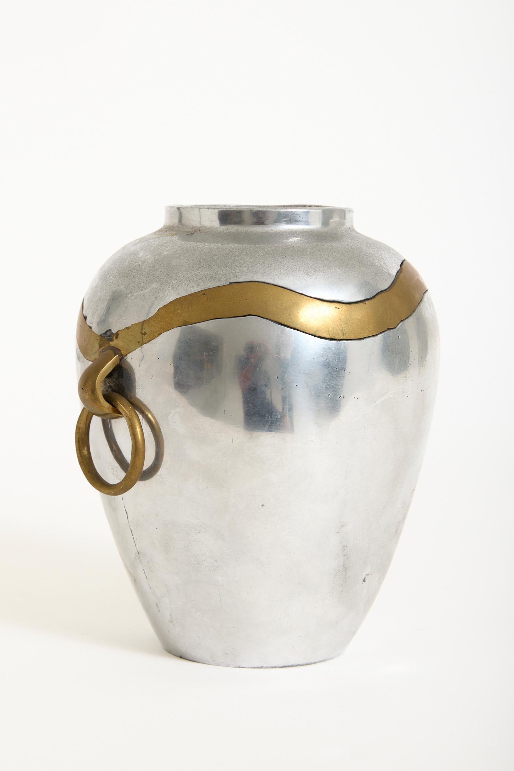 A large Brutalist brass and aluminium vase with twin handles by David Marshall
Spain, 1970s
