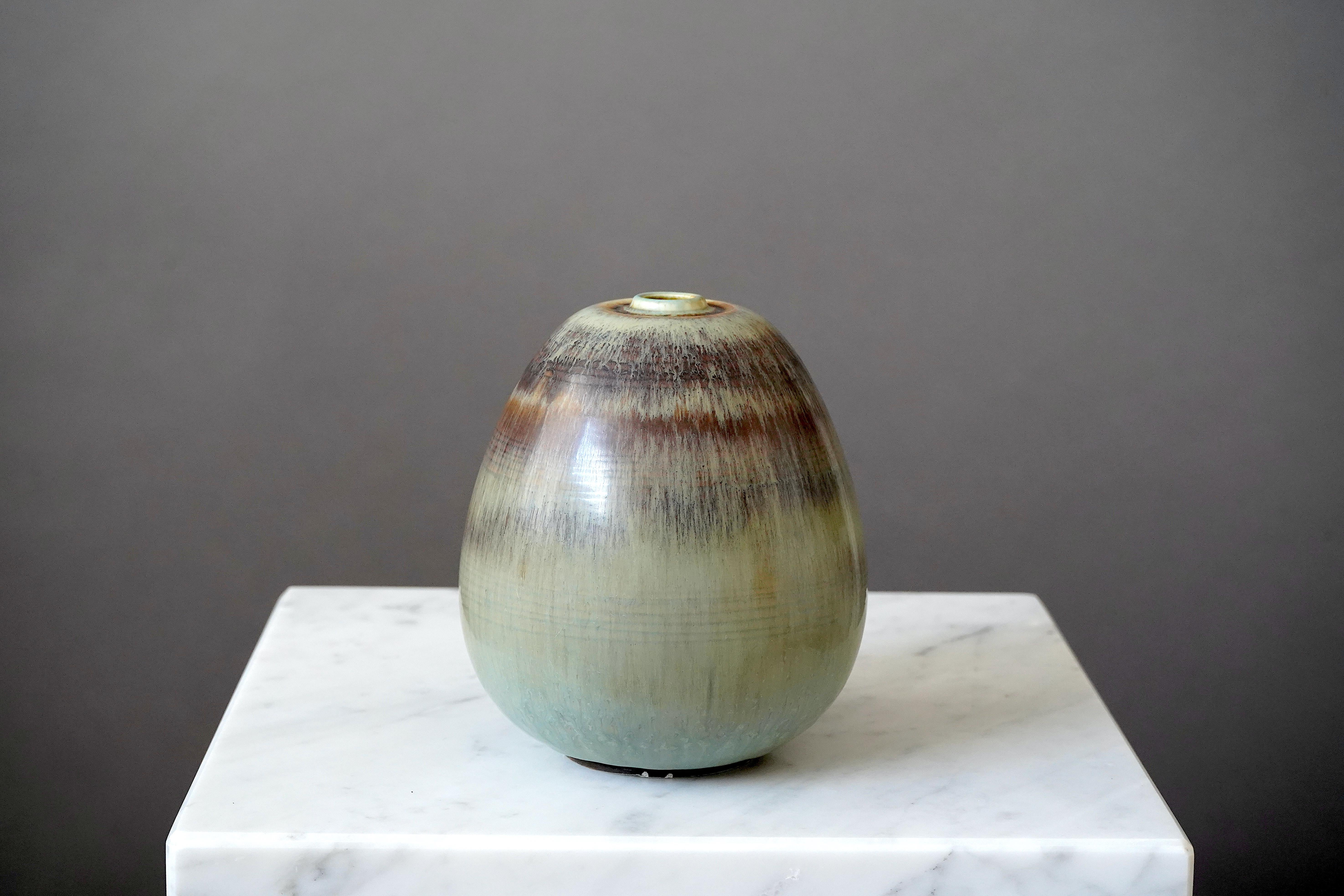 Beautiful and rare stoneware vase designed by Gertrud Lönegren.
This studio piece was created at Rorstrand in Sweden between 1936-41.

Exquisite glaze. Impressed 'Rörstrand / Lönegren / SWEDEN / HANDDREJAD'.

Good condition but with a couple of