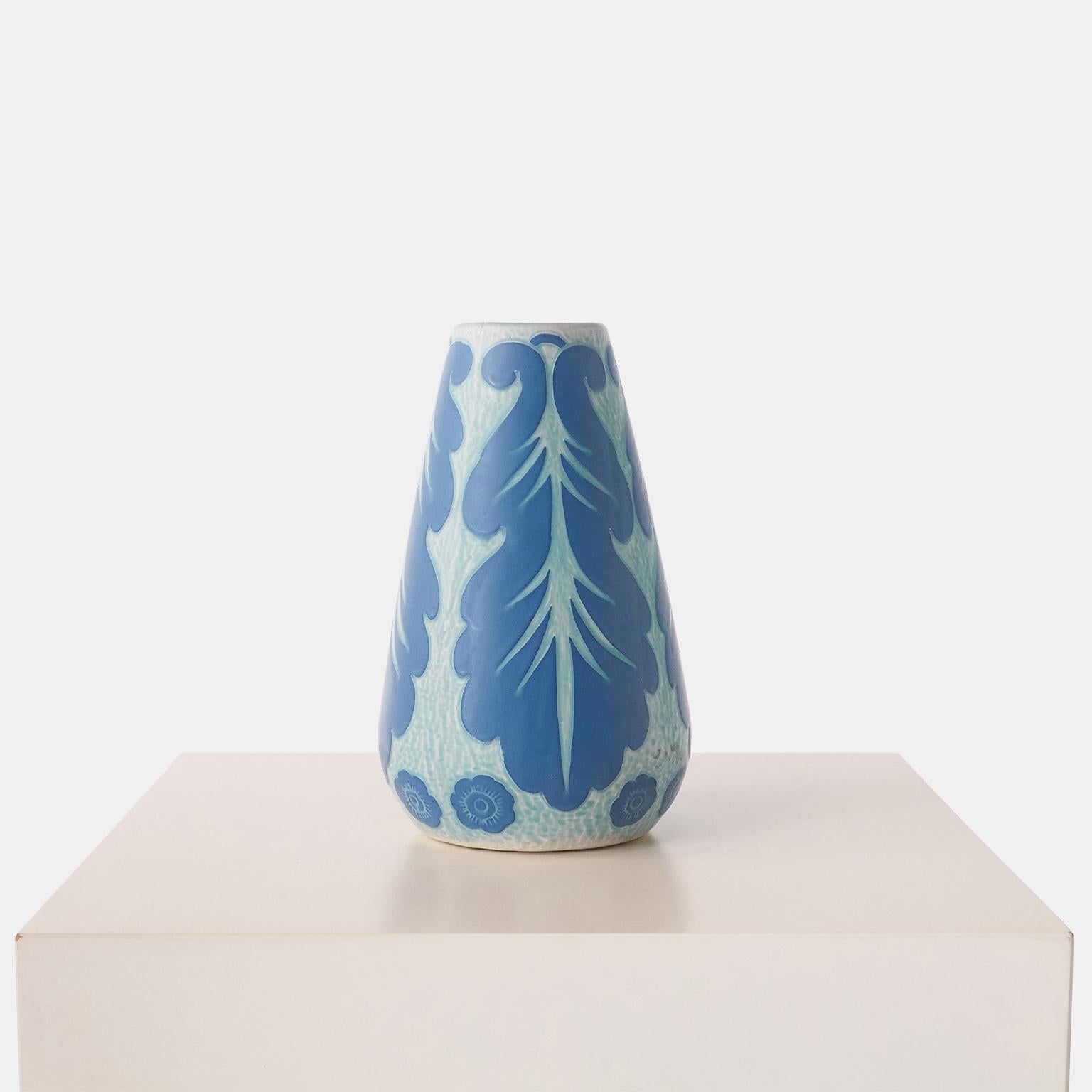 A handmade blue vase by Josef Ekberg for Gustavsberg. Each piece is unique and decorated with the Sgrafitto technique that was developed by Ekberg himself.

Signed on base : Gustavberg, 1920, JE.