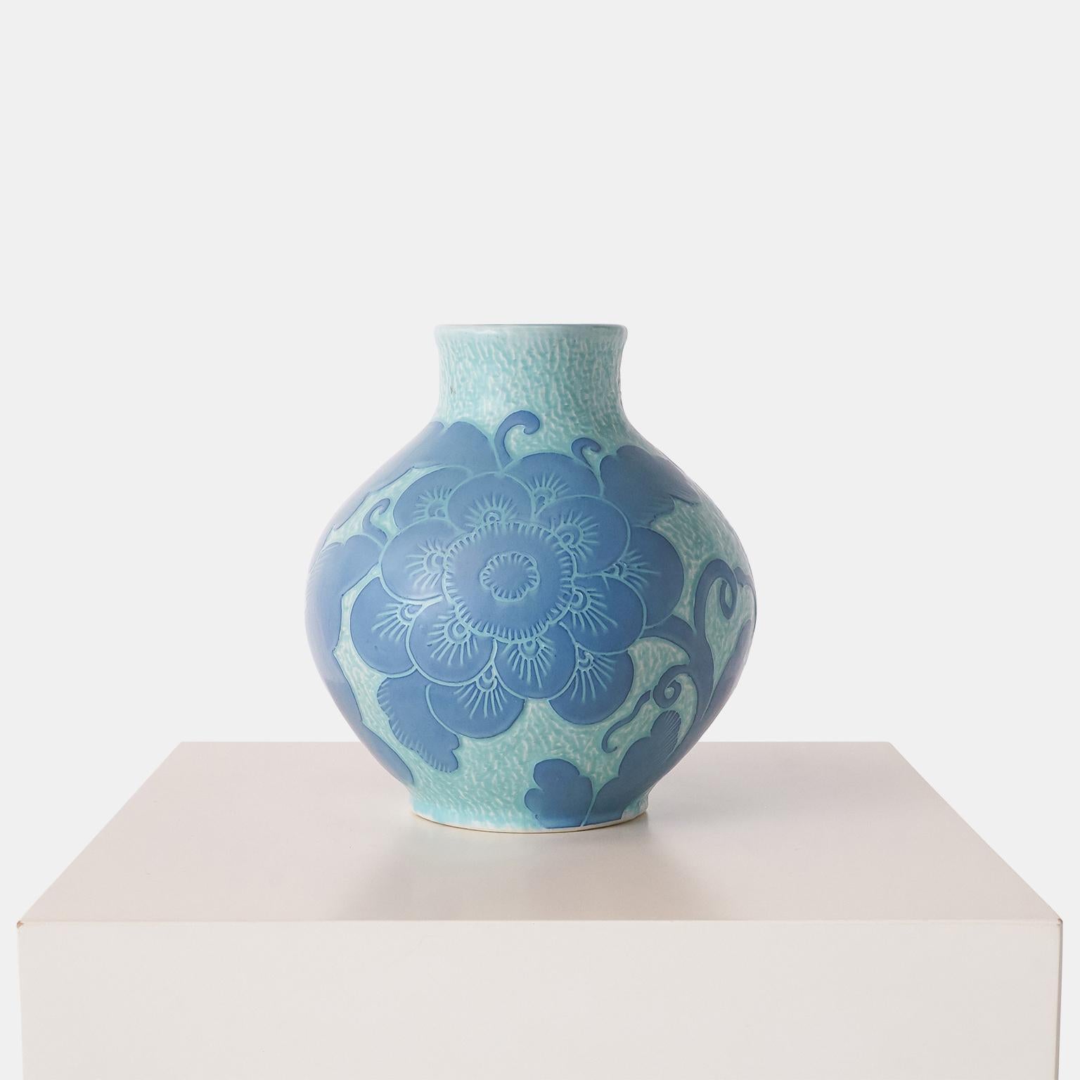 A handmade blue vase by Josef Ekberg for Gustavsberg. Each piece is unique and decorated with the Sgrafitto technique that was developed by Ekberg himself.

Signed : Gustavsberg, 1919, J Ekberg.