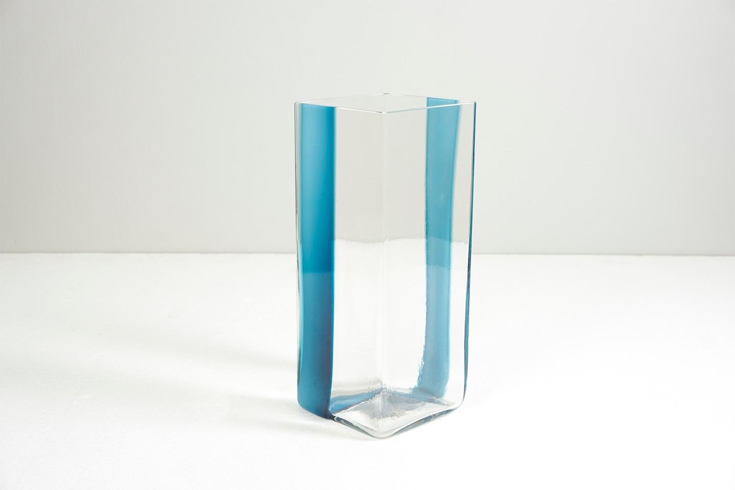 Glass with grey-blue ribbon, mouth blown
Dimensions: H 30cm, W 12cm, D 12cm.
Design / Ludovico Diaz de Santillana for Pierre Cardin, 1969
Manufacturer / Venini, Murano
Signed 