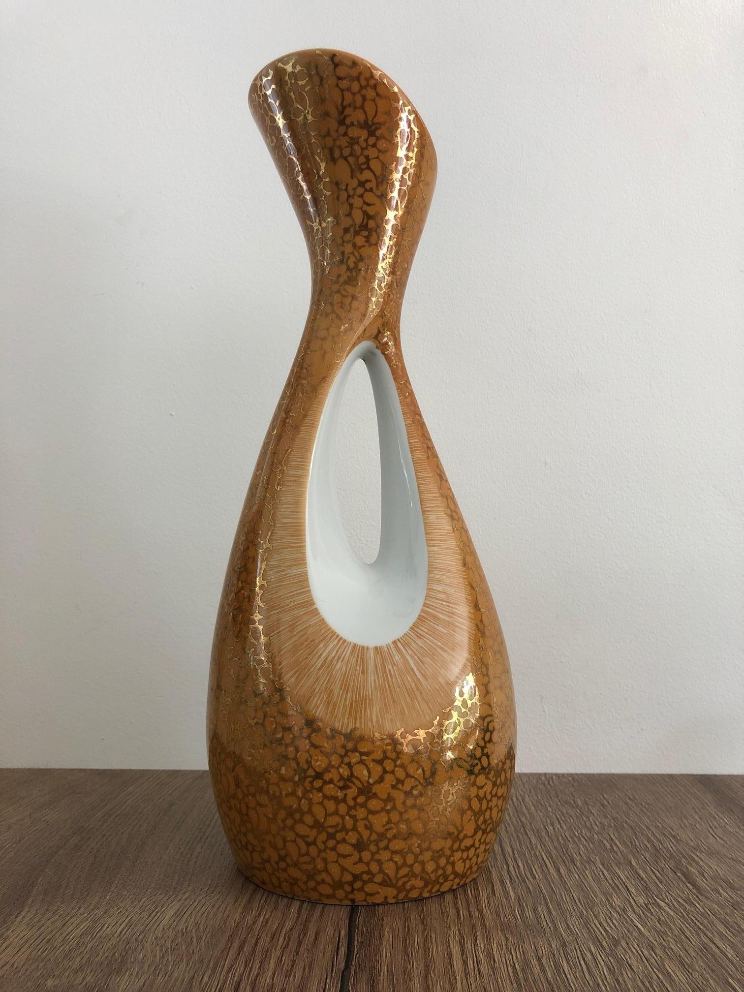 Vase model ''Calypso'' designed by Zbigniewa Sliwowska-Wawrzyniak in 1957, produced by Porcelain Factory ''Cmielów'' in Poland in the 1960s. Very rare orange-goldish glazing. Perfect condition. Signature on the bottom.
