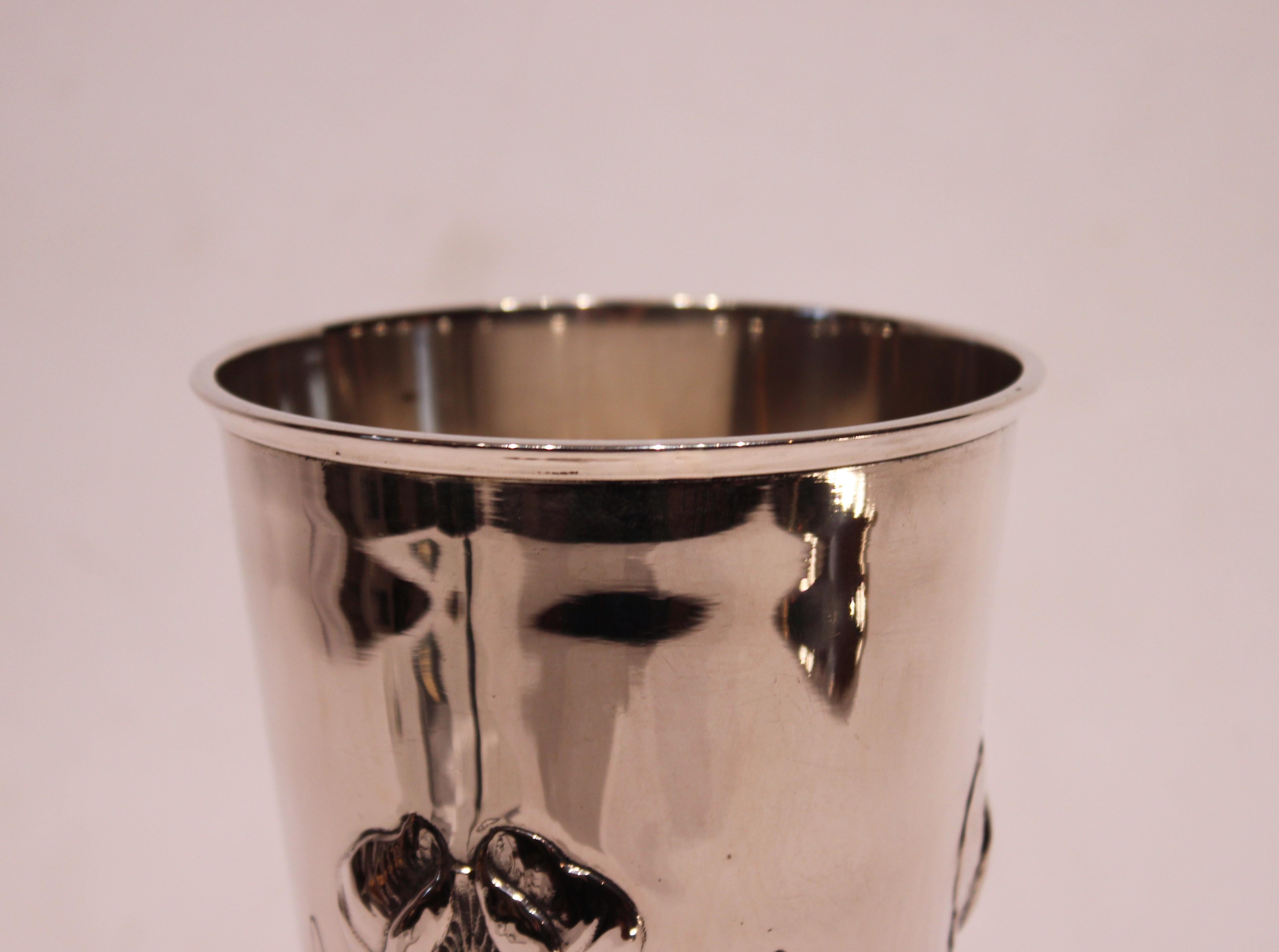 Vase decorated with flowers and of hallmarked silver. The vase is in great vintage condition.