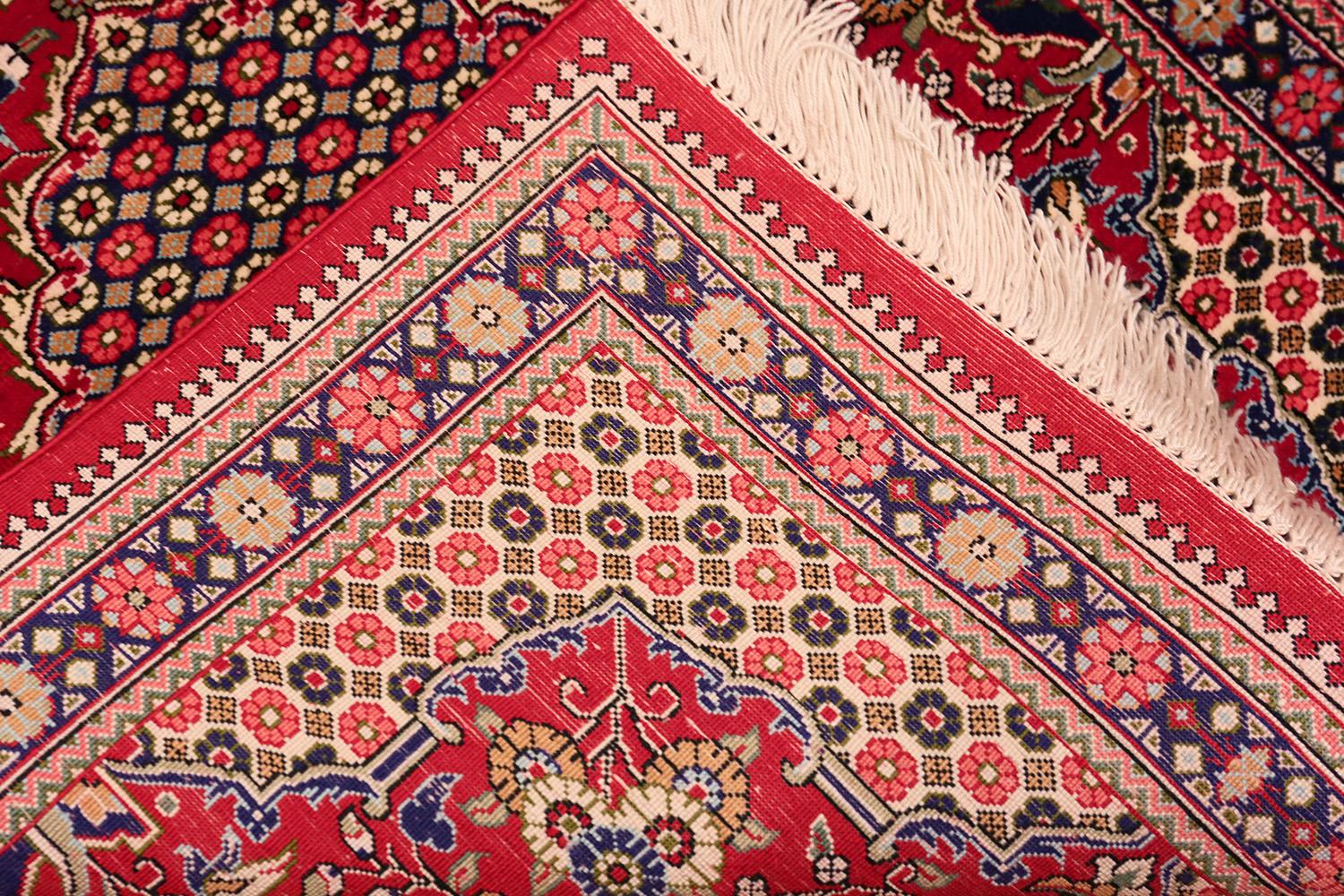 Stunning Vase Design Small Vintage Silk Persian Qum Rug , Country of Origin / Rug Type: Vintage Persian Rug, Circa Date: Late 20th Century - Size: 1 ft 9 in x 2 ft 4 in (0.53 m x 0.71 m).