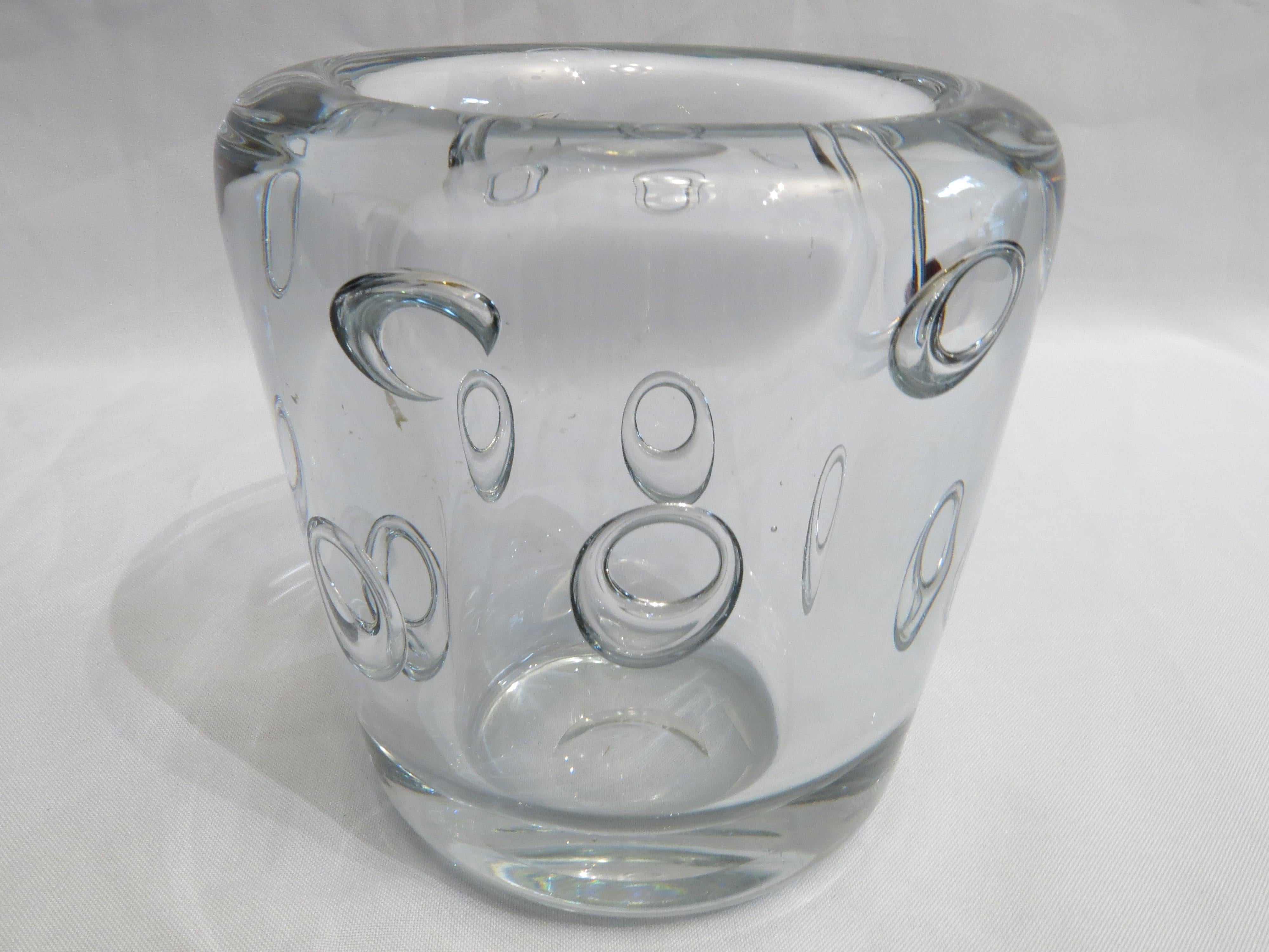 Introducing a striking example of mid-century modern design: the transparent glass vase with bubbles underlay, designed by Gunnar Nylund for Stromberg, Sweden, in the 1950s. This exquisite piece embodies the minimalist elegance and innovative spirit