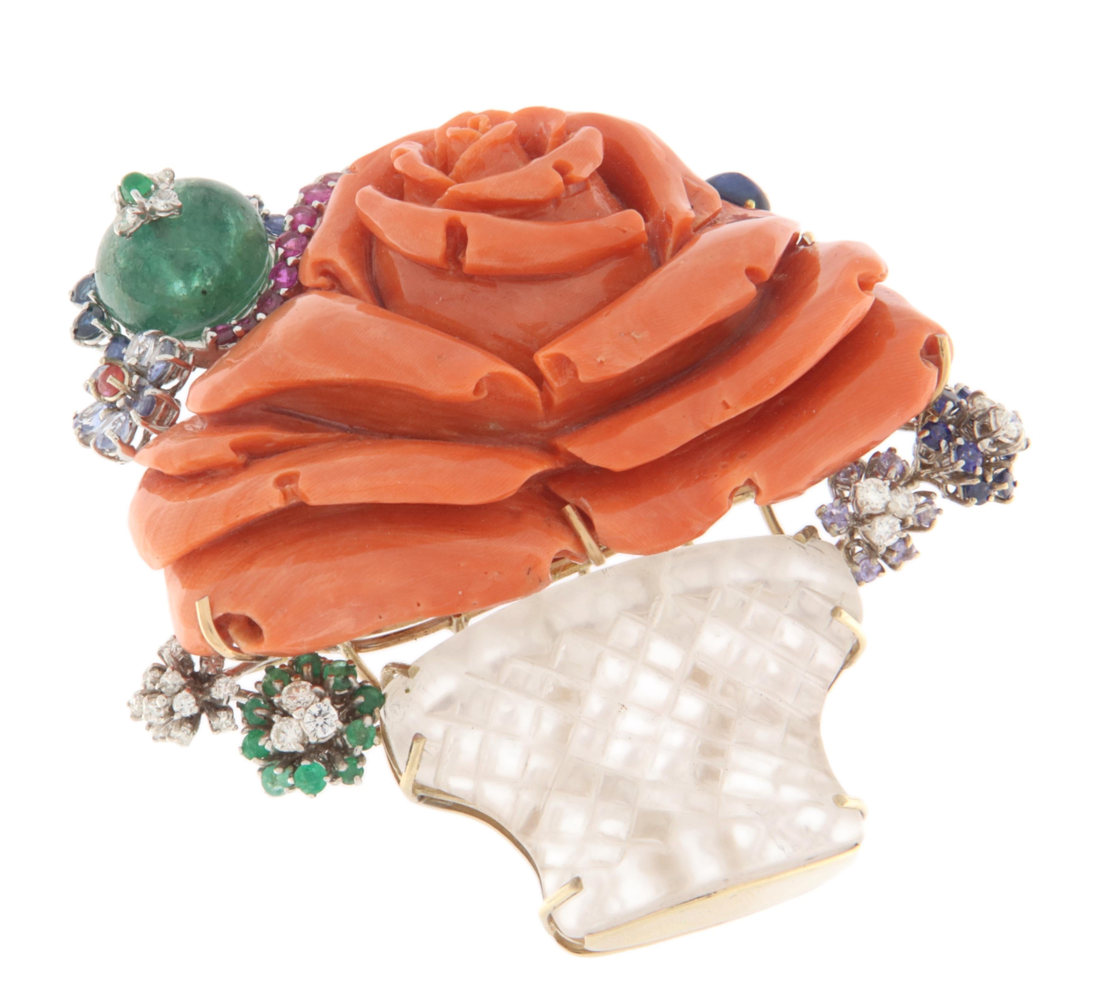 This extraordinary brooch is a refined example of high jewelry and craftsmanship, created to captivate anyone who admires it. Made of 18-karat white and yellow gold, the brooch is designed in the shape of a flower vase, with a combination of