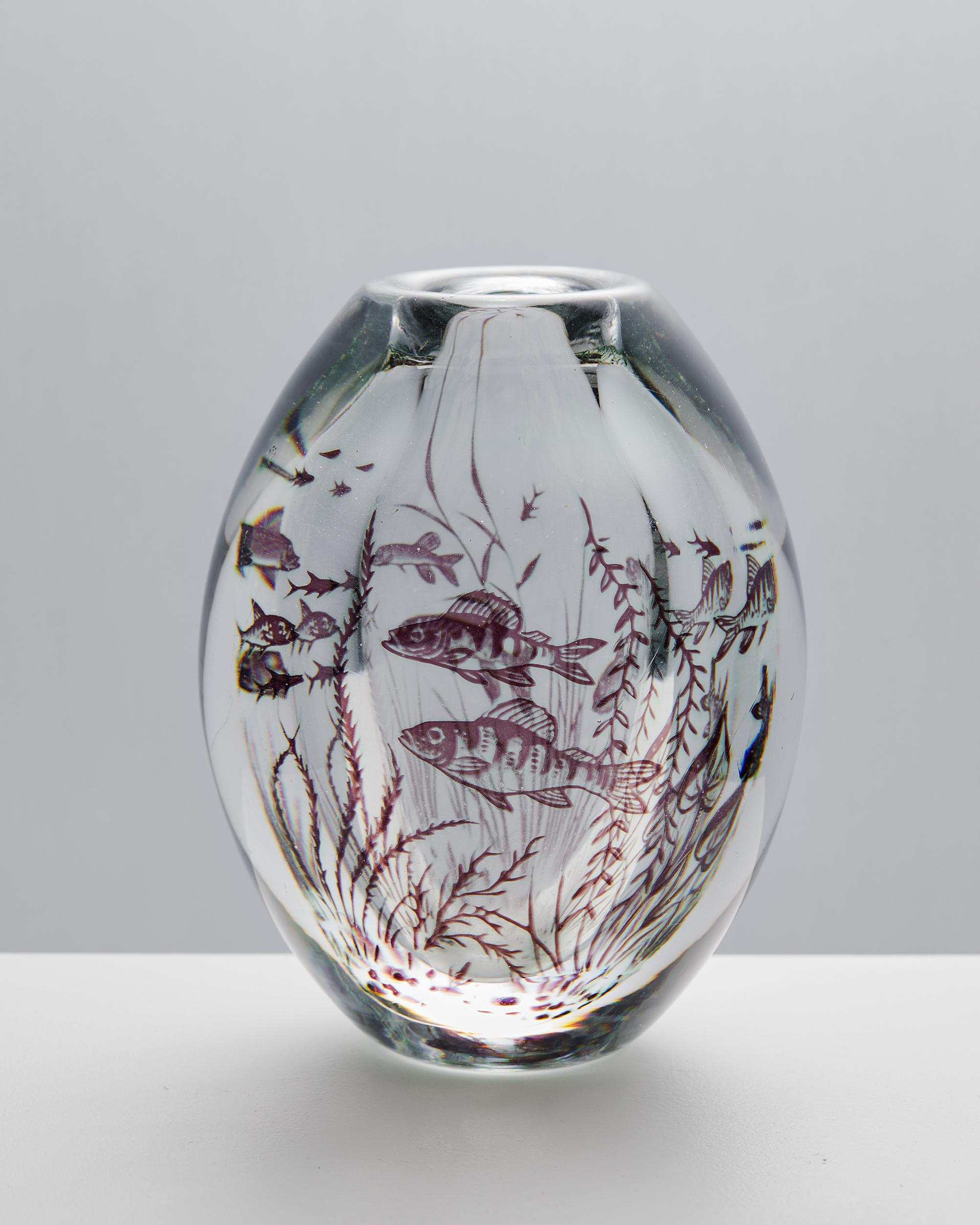 Vase ‘Fish Graal’ designed by Edward Hald for Orrefors,
Sweden, 1949.

Glass.

Signed.

Dimensions: 
Height: 16 cm / 6 1/4''
Diameter: 12 cm / 4 3/4''.

Edward Hald (1883 – 1980) is one of the well-known Swedish glass artists who have worked for