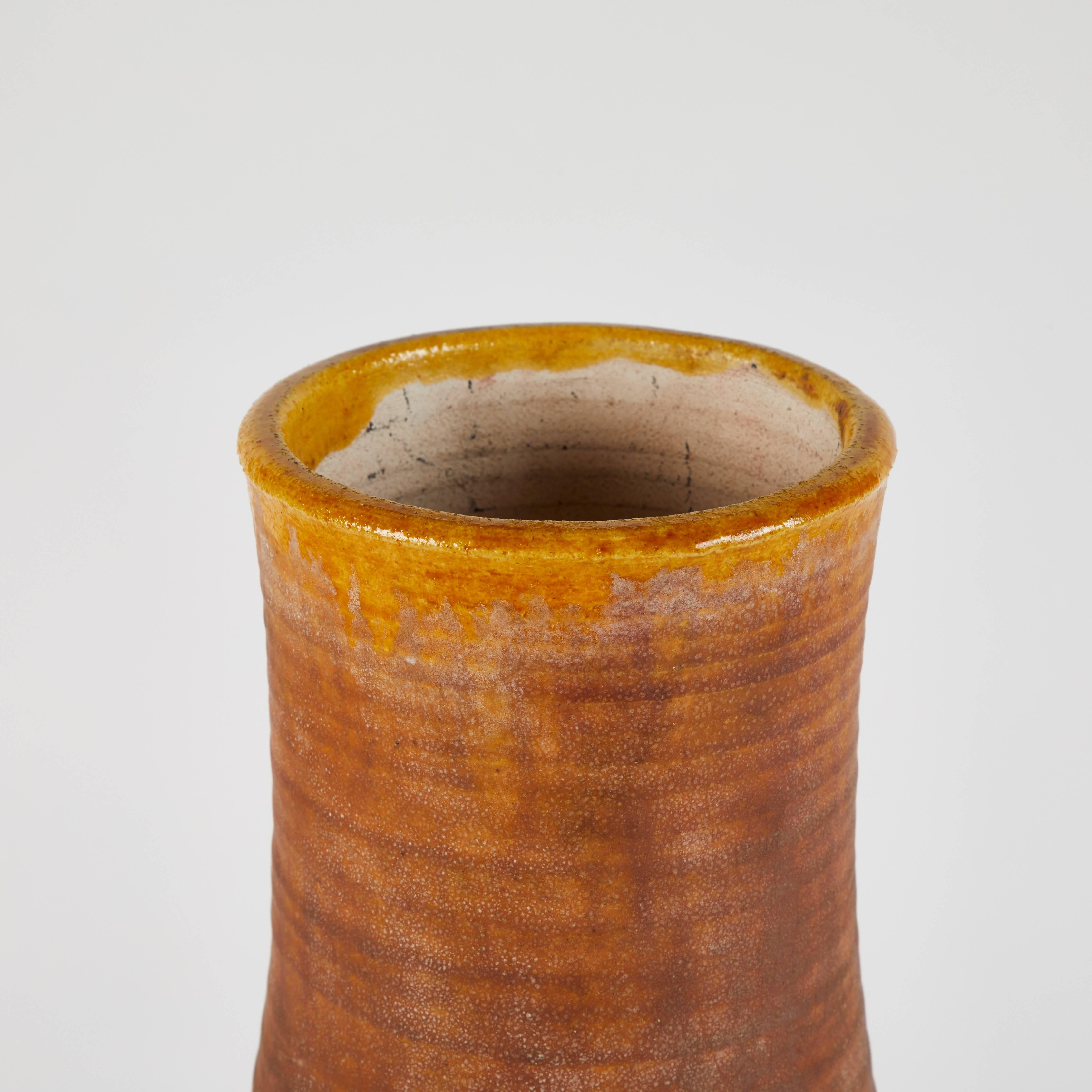 1930s pottery vase with natural orange exterior and glazed interior.