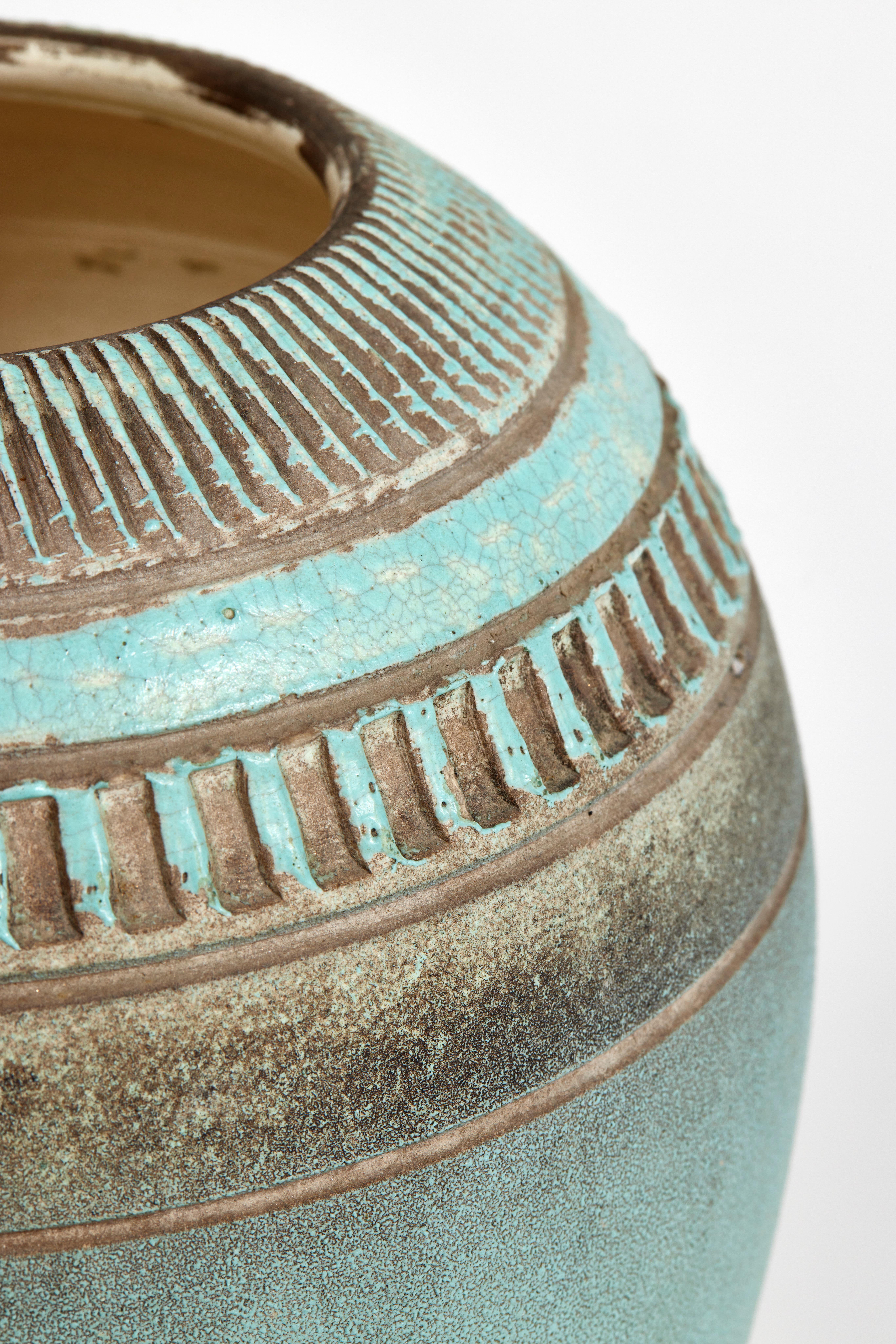 Stoneware ovoid vase by Jean Besnard.
Decorated with radiating vertical bands in hollow, entirely enameled turquoise blue and ochre on cream interior.
Signed at the bottom 