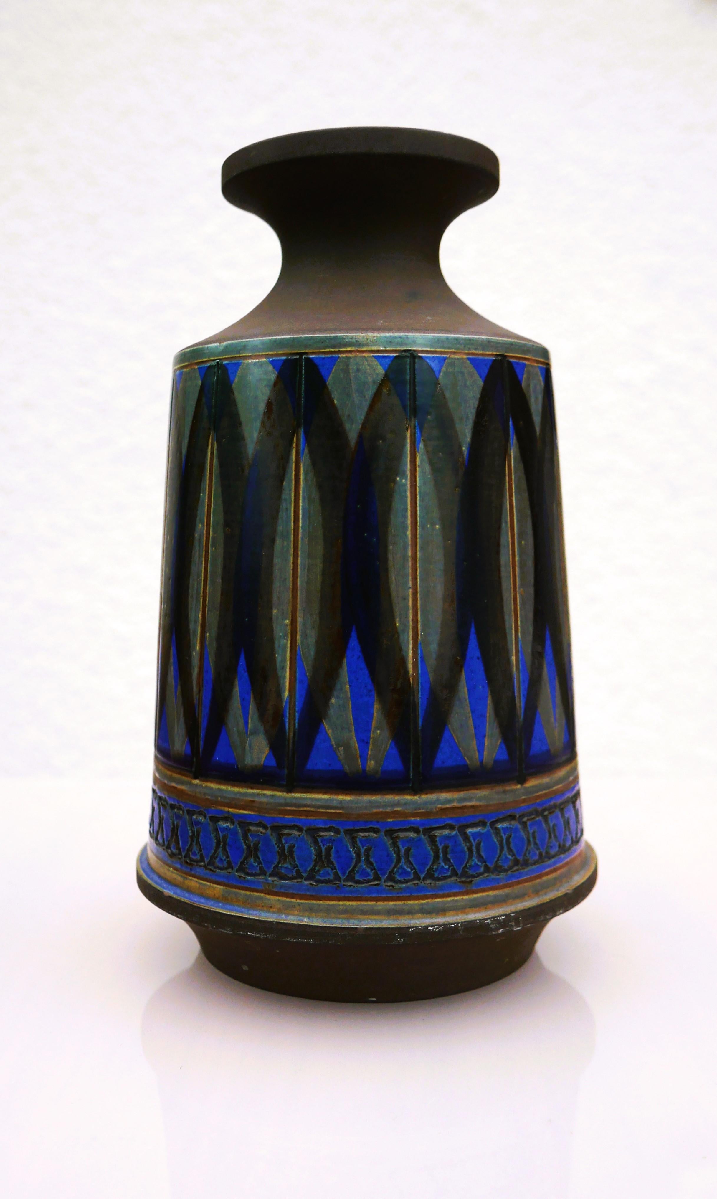 This is a stunning  stoneware vase from Alingsås keramik, Sweden. It is handmade by Ullah Winbladh and signed by her. The pattern and the glazing is just amazing and so typical of her work. The colors are pale green and  bright blue in various