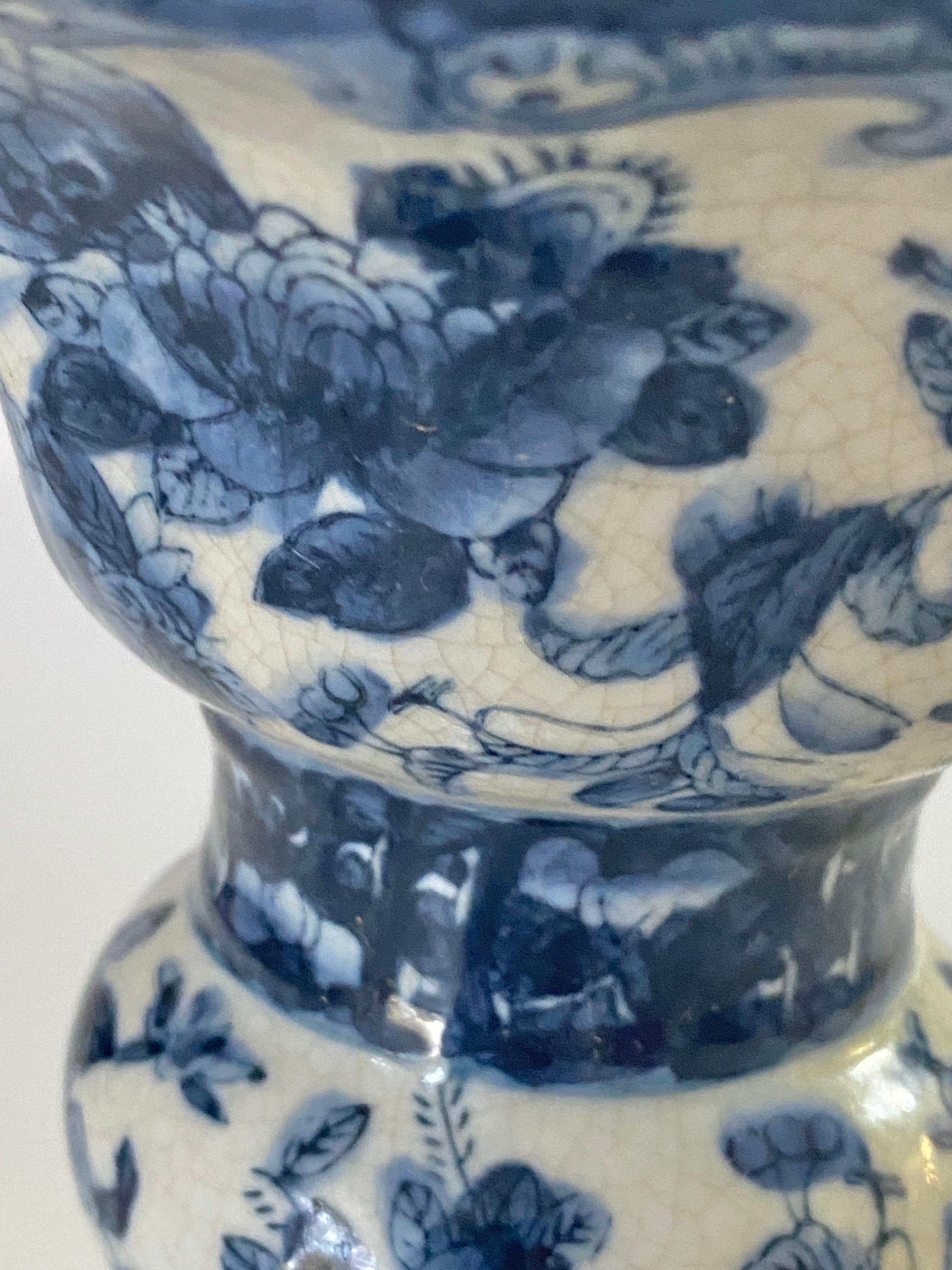 Chinese vase, blue cobalt, and white porcelain.
late 19th century. leaves and birdsdecor pattern.


