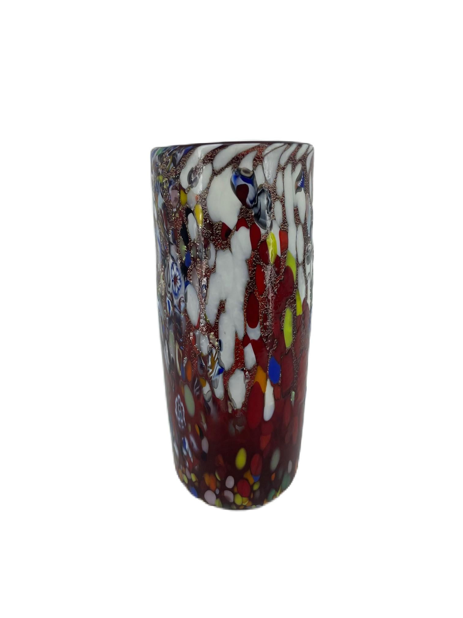 Vase from the ‘Fantasy’ collection in red blown Murano glass with assorted decoration of multicolour glass ‘Mace”, Murrina Millefiori and silver leaf.
The vase has been hand-crafted by Murano master glassmaker Imperio Rossi.
Original Murano Vetro