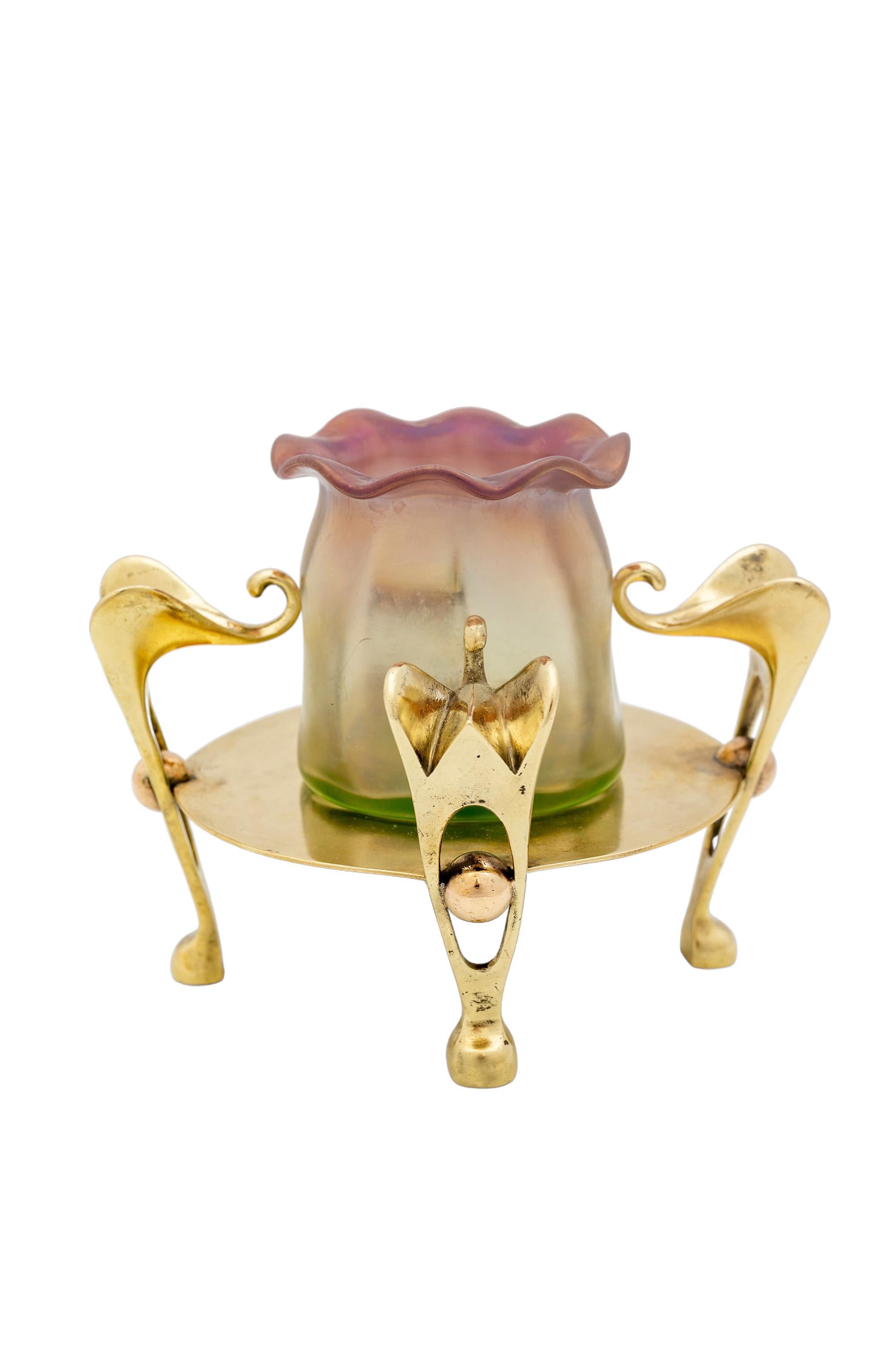 Small but elegant glass vase in a polished brass mount.
The vase was designed by Antoinette Krasnik (School of Koloman Moser).
The vase was produced by the Bohemian glass manufacture Johann Loetz Witwe, which sold their products in Vienna at the end