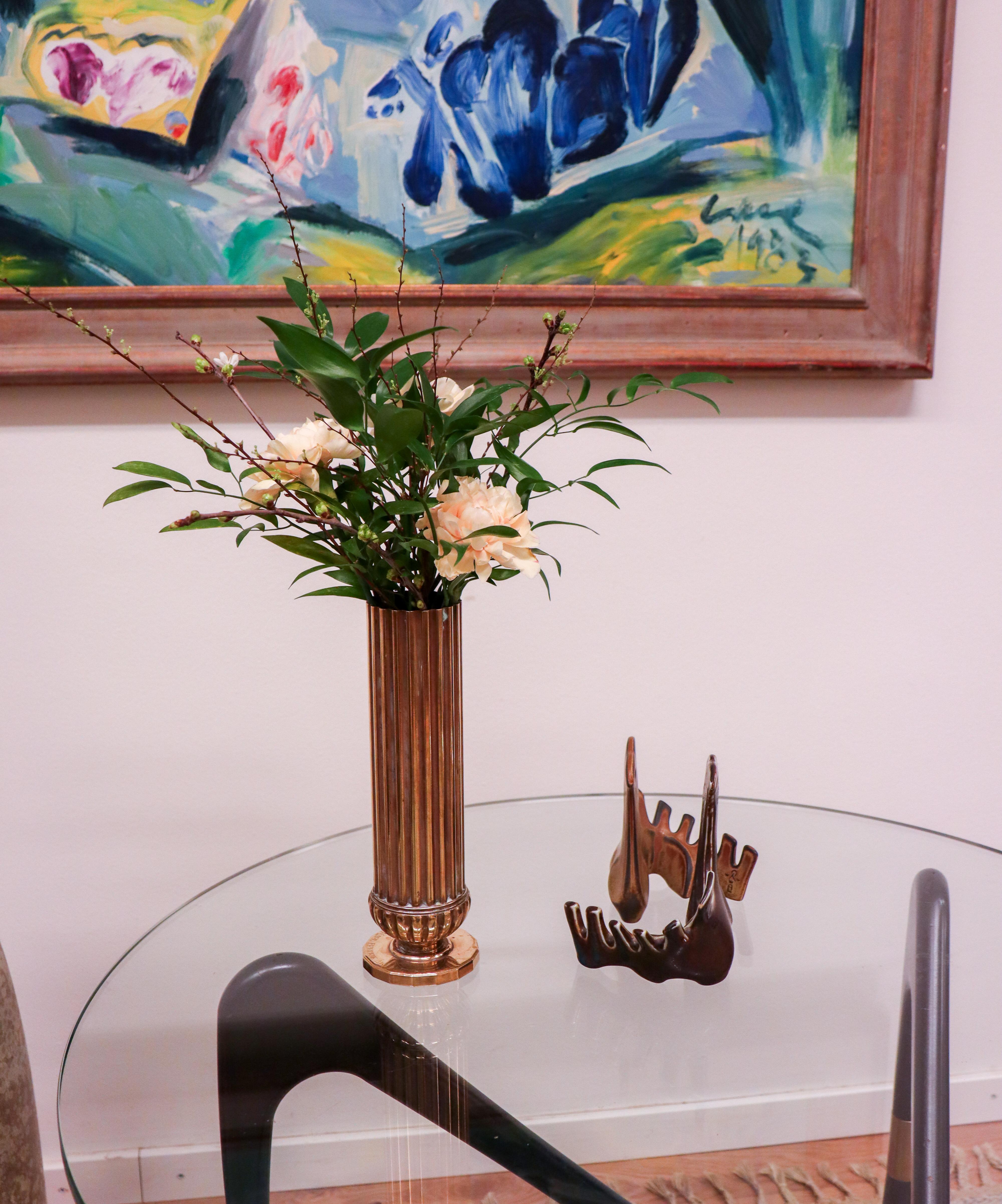 A vase in brass designed at AB Svenska Metallverken. The vase is 23 cm high and in excellent condition except from engraving at the base and some scratches. 