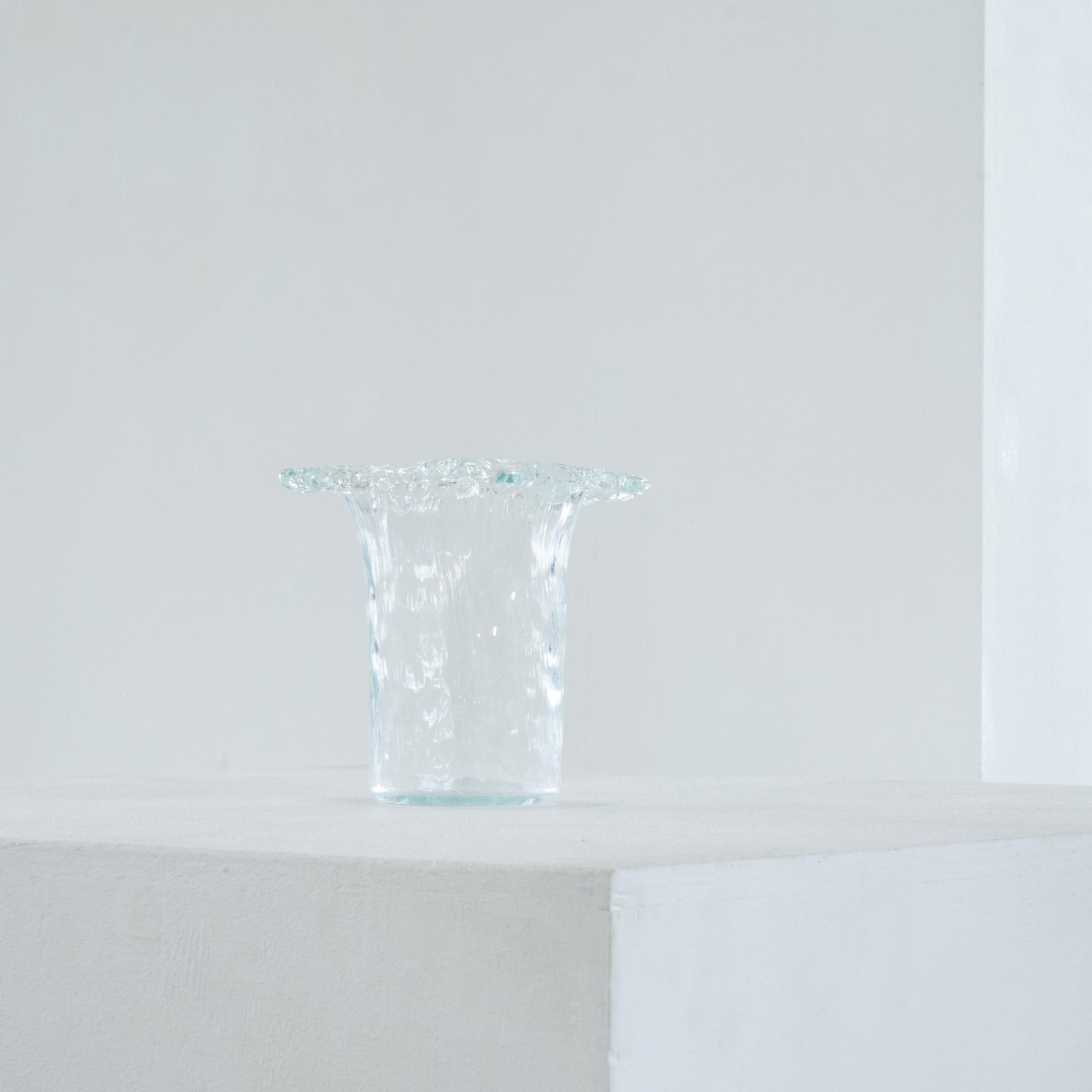 Vase in carved glass 1970s, in the style of Tapio Wirkkala.

Wonderful and elegant vase in carved glass which resembles carved ice. Similar to works by designer Tapio Wirkkala. Stylish, timeless and very good in quality and execution. The slightly