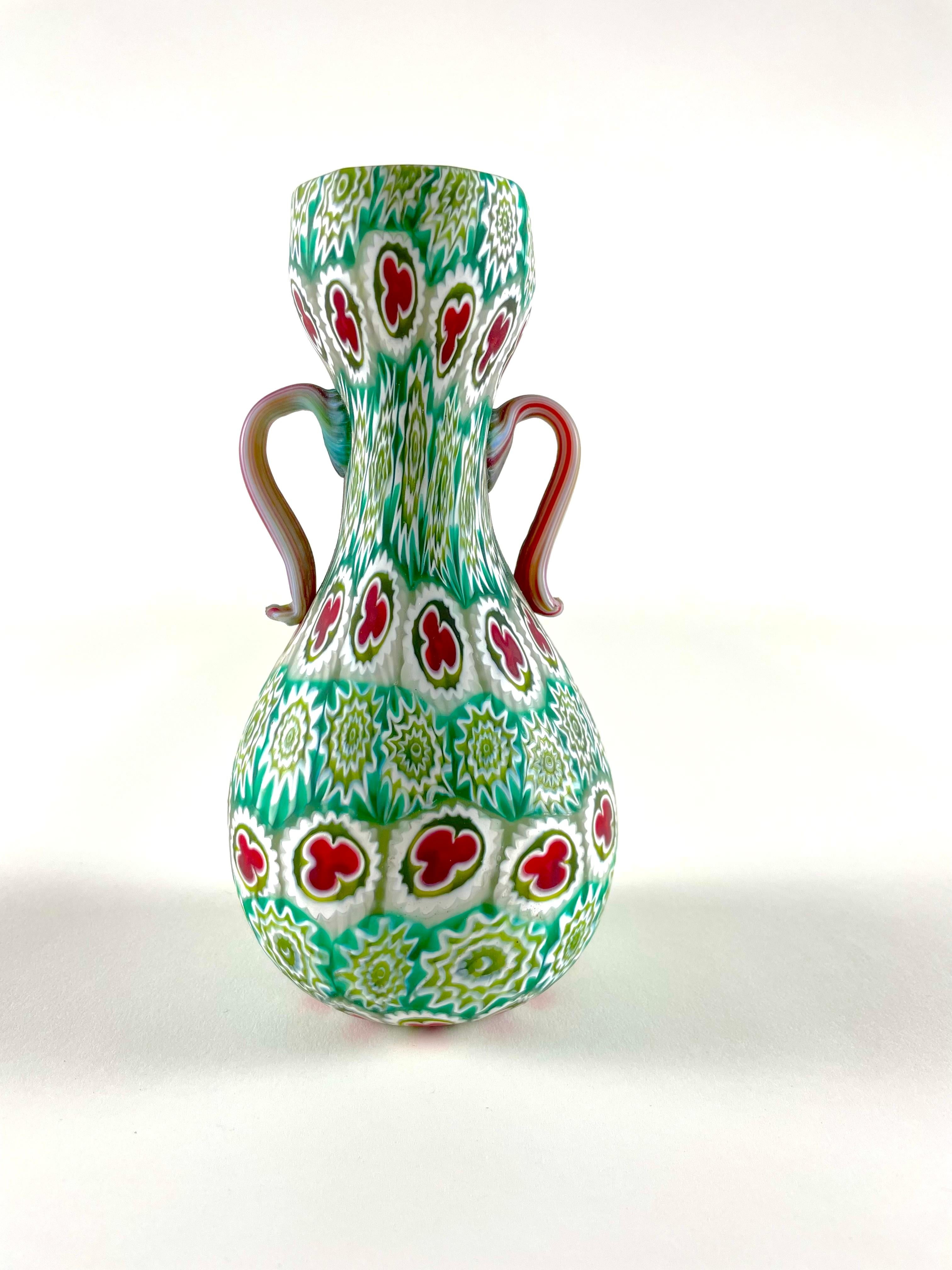 Millefiori Murrina vase by Fratelli Toso. This classic design hails from the '50s and showcases the true craftsmanship that made Fratelli Toso famous. Each piece is meticulously crafted using the murrina technique, making it a collectible vintage