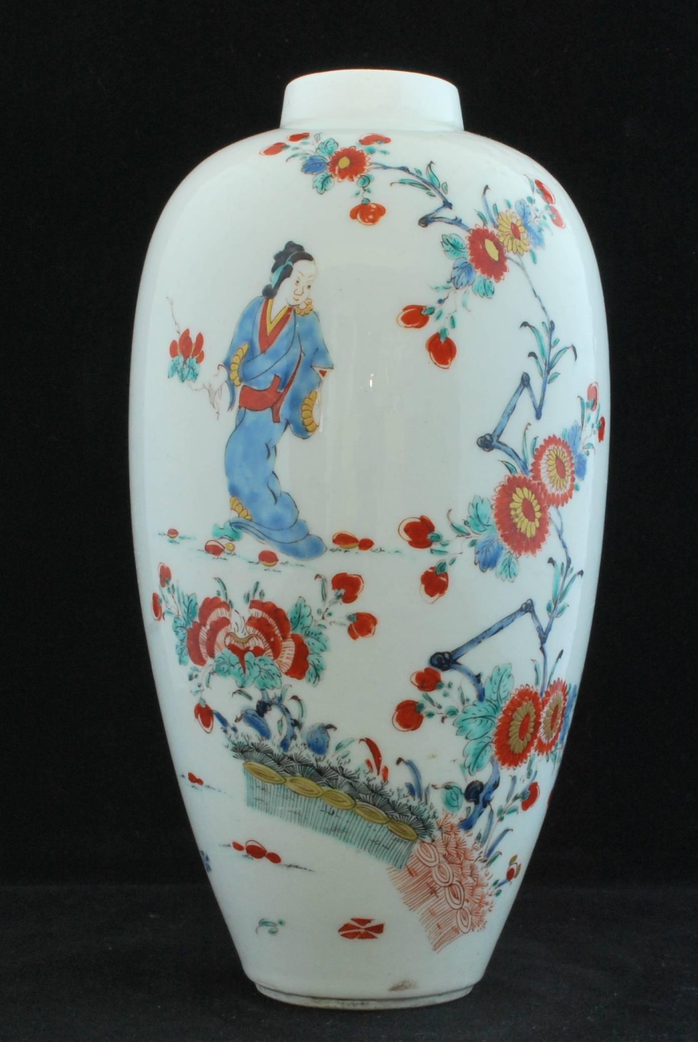 Of elongated high shouldered ovoid form with cylindrical neck after a traditional meiping (prunus vase). Painted in a Kakiemon palette with a lady in a kimono, a flowering branch from banded hedges, flower sprays and flowerheads.

Provenance: