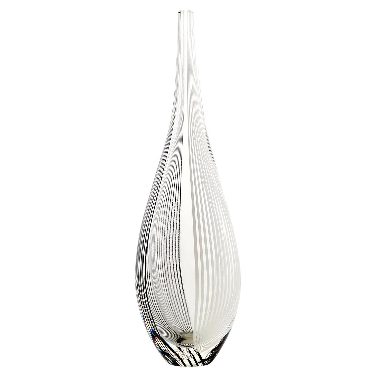A gorgeous Italian glass vase by Lino Tagliapietra for Effetre International, Murano, 1986.
Clear glass with black and white strips.
The vase still has an Effetre International label on it.
It is also graven at the bottom with Lino Tagliapietra,