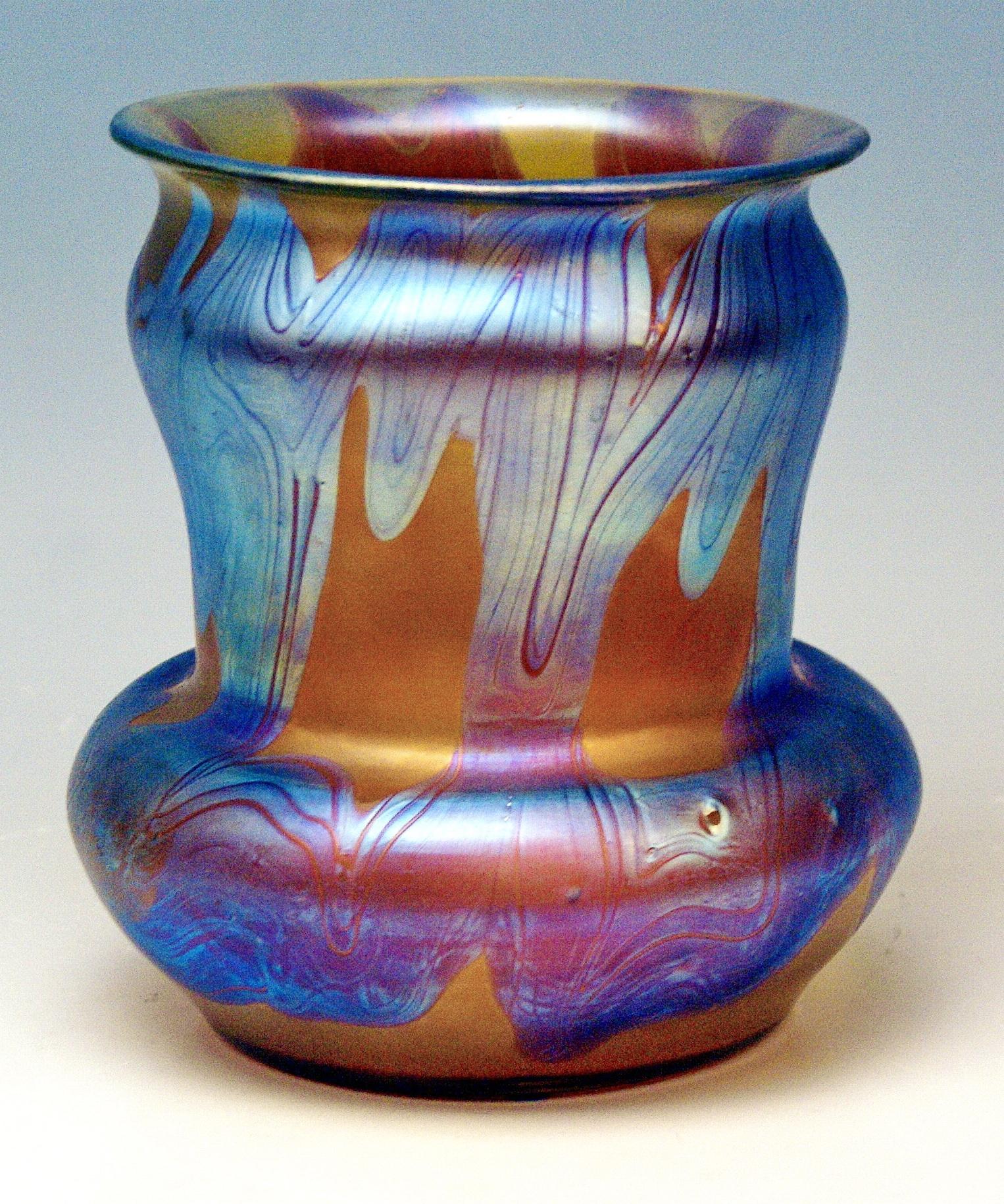 Vase Loetz (Lötz) Widow Klostermuehle Bohemia Art Nouveau

Made by Loetz, Klostermuehle (Bohemia), circa 1900
Decor: Phaenomen Genre 7773 or PG 29
 
It is an interesting Loetz Art Nouveau vase of cylindric type with smooth wide and overhanging