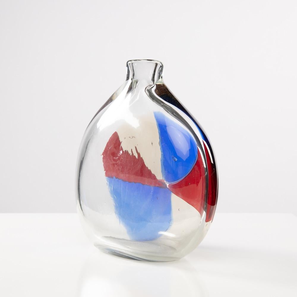 Vase in thick transparent glass, one side of the vase decorated with a 